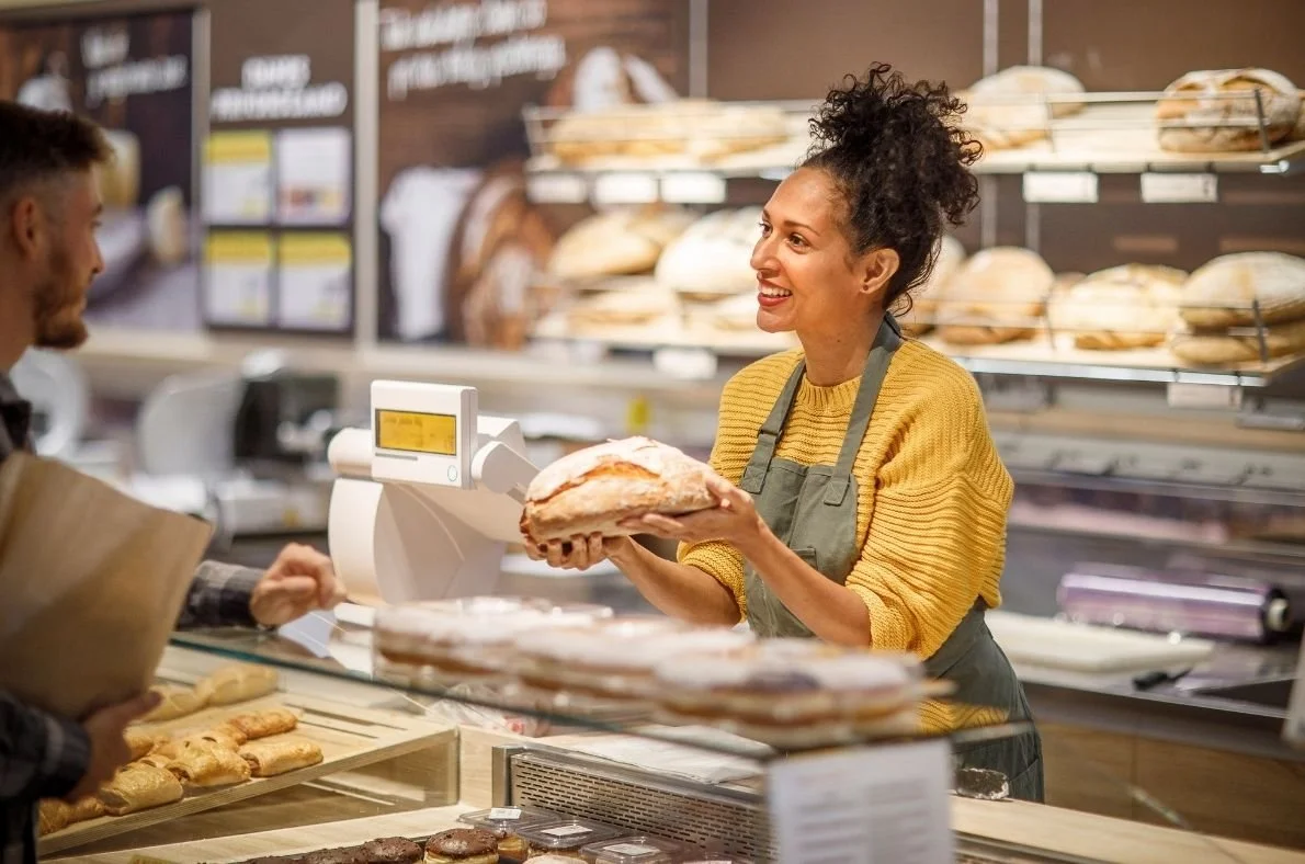Small business owner serving a customer