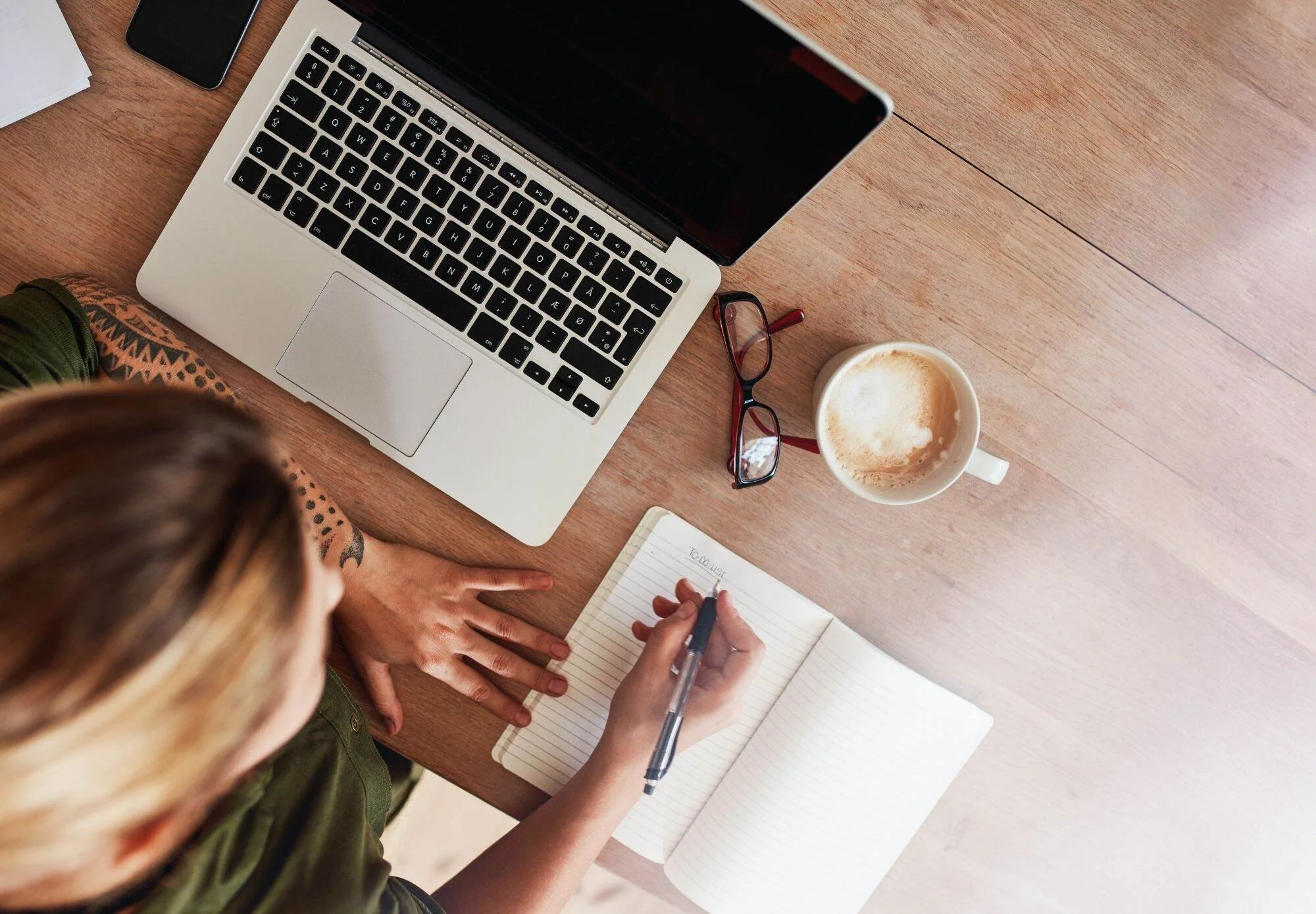 Entrepreneur taking notes during a systems strategy session