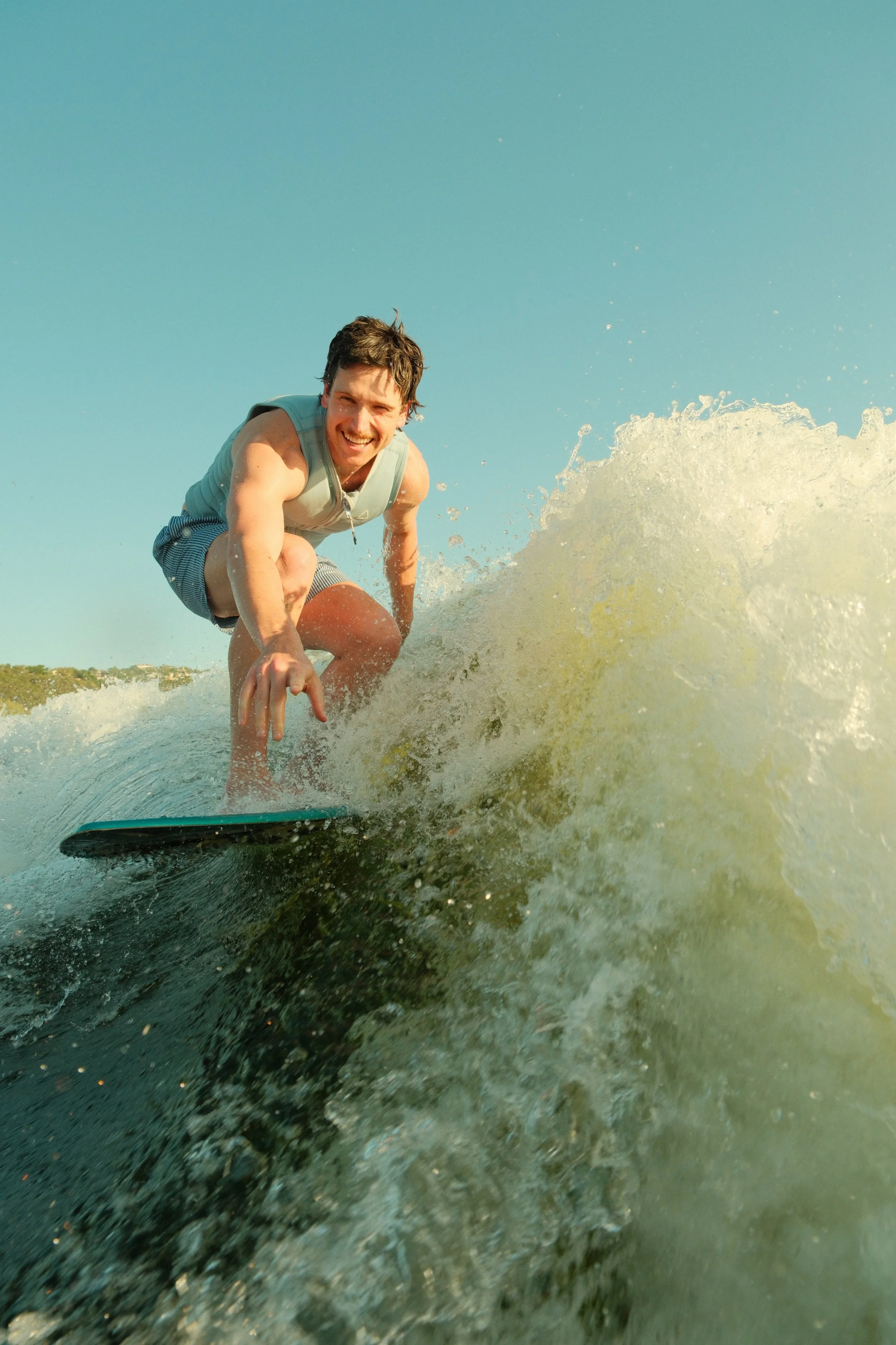 Male on wake surf board representing growth, momentum, and strategic movement for modern brands and organizations.