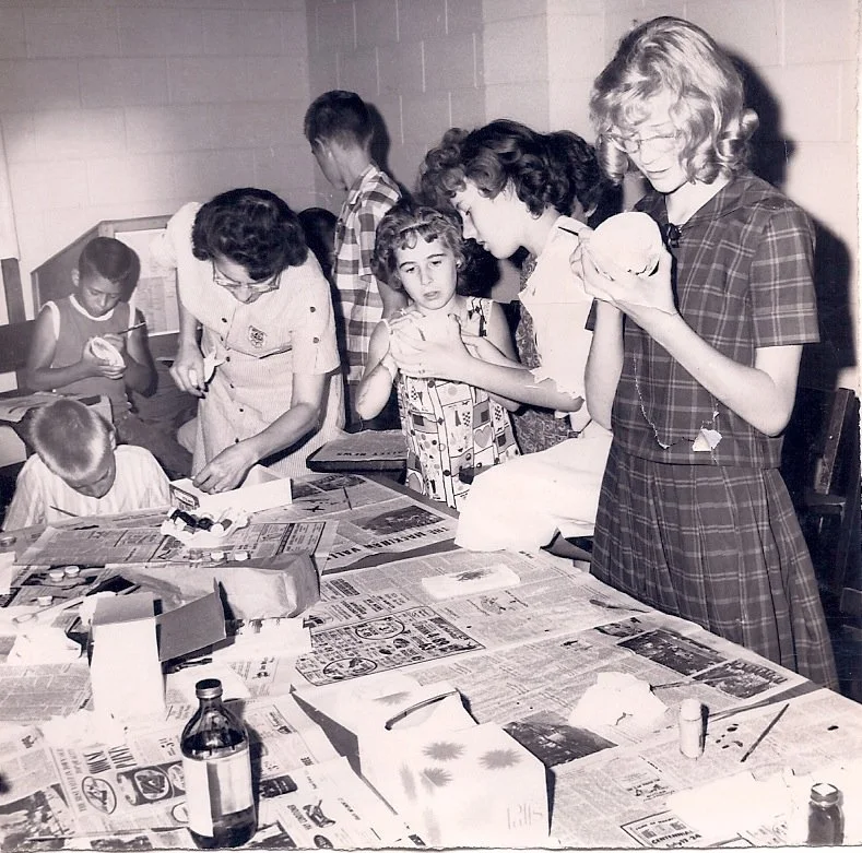 VBS kids working on a craft in the basement of the church in the mid 1960s.