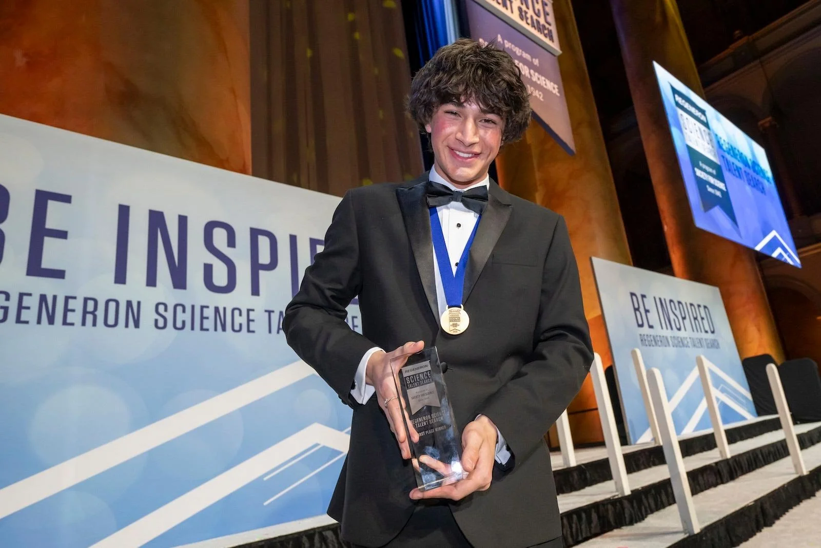 2025-Regeneron-Science-Talent-Search-Winner-Matteo-Paz-Holds-His-Trophy.jpg