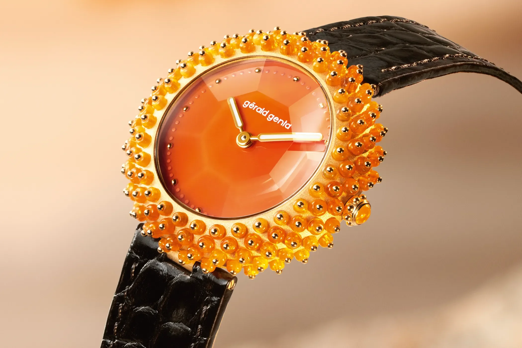 Gérald Genta Gentissima Oursin Fire Opal watch in 18k yellow gold with fire opal bezel and orange carnelian dial – Photography courtesy of Swisswatches.