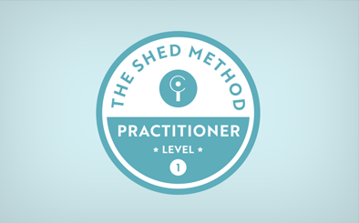 Logo for The Shed Method Practitioner Level 1, featuring a circular design with a keyhole symbol.