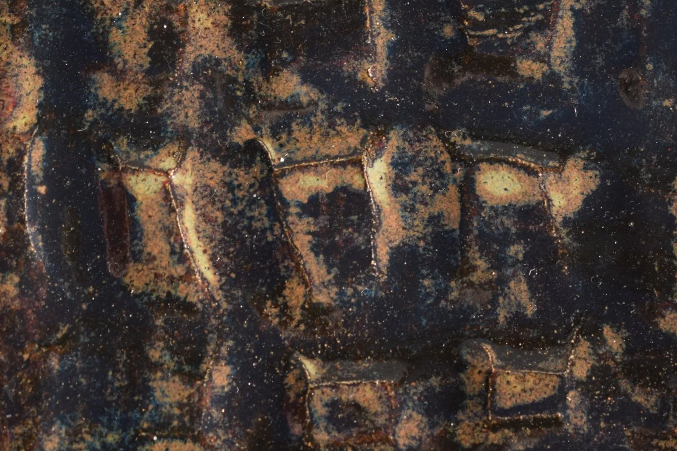 CAST IRON: Black with light brown areas and hints of blue