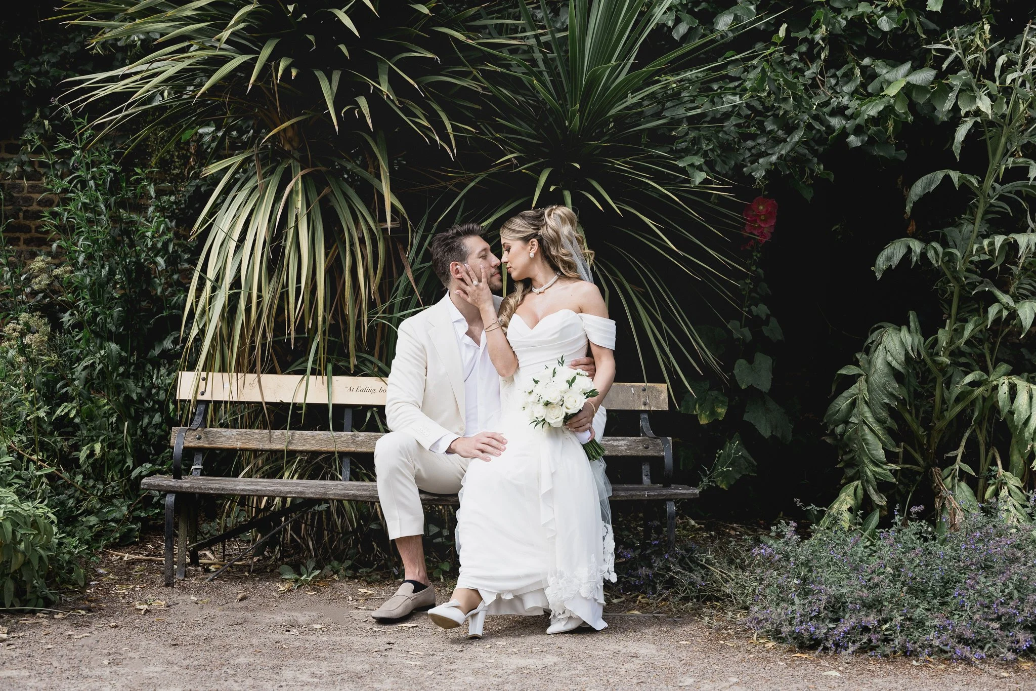Laurie’s customers, Fernando and Kate embracing by the lake on their wedding day.