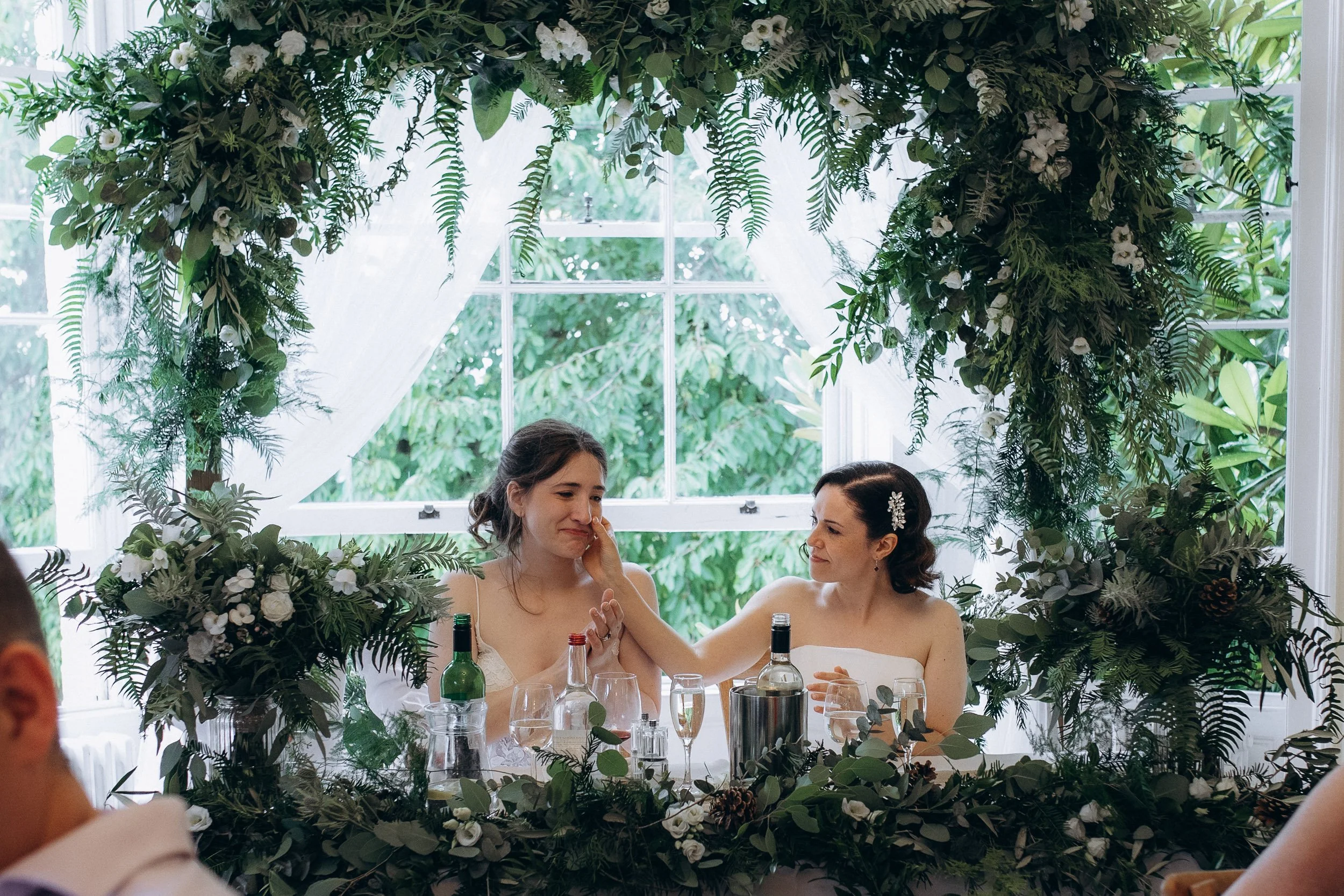 Two brides toasting at Pembroke Lodge reception