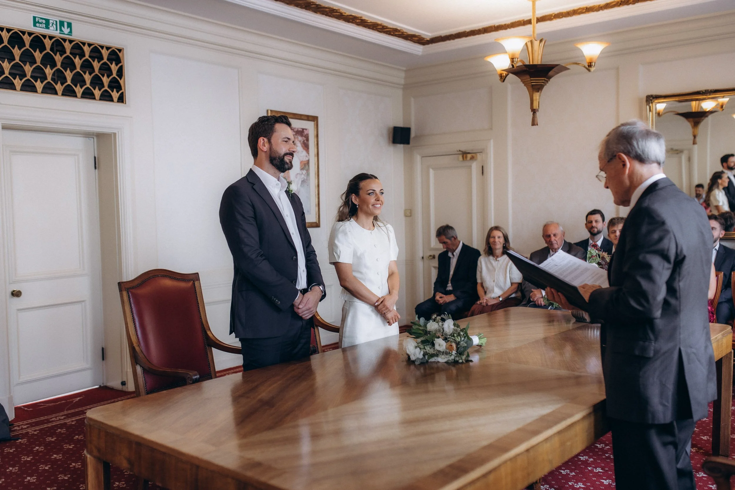  Registrar speaking to the bride and groom during their Wandsworth register office wedding 