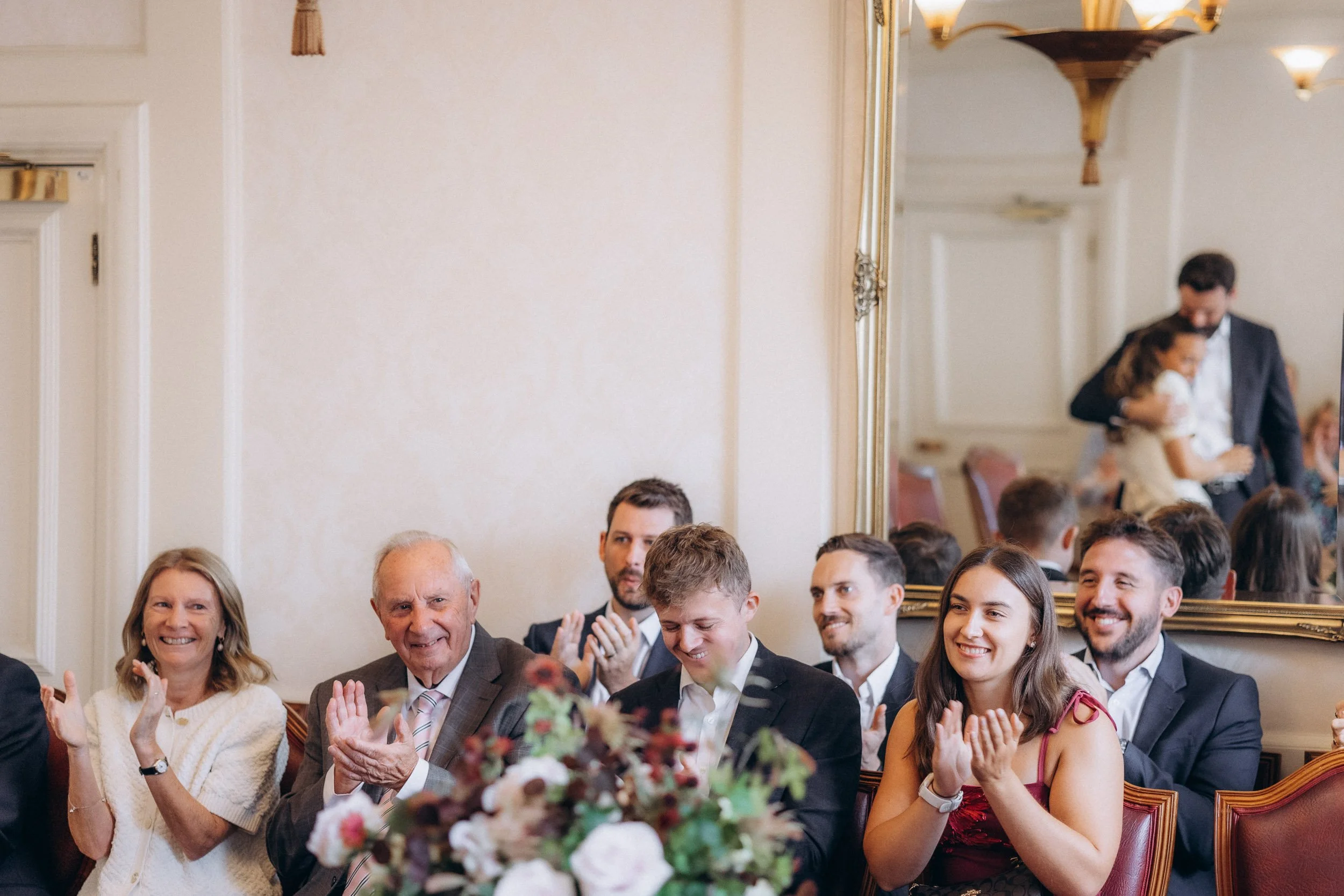  Wedding guests applauding the couple during the ceremony at Wandsworth Town Hall 