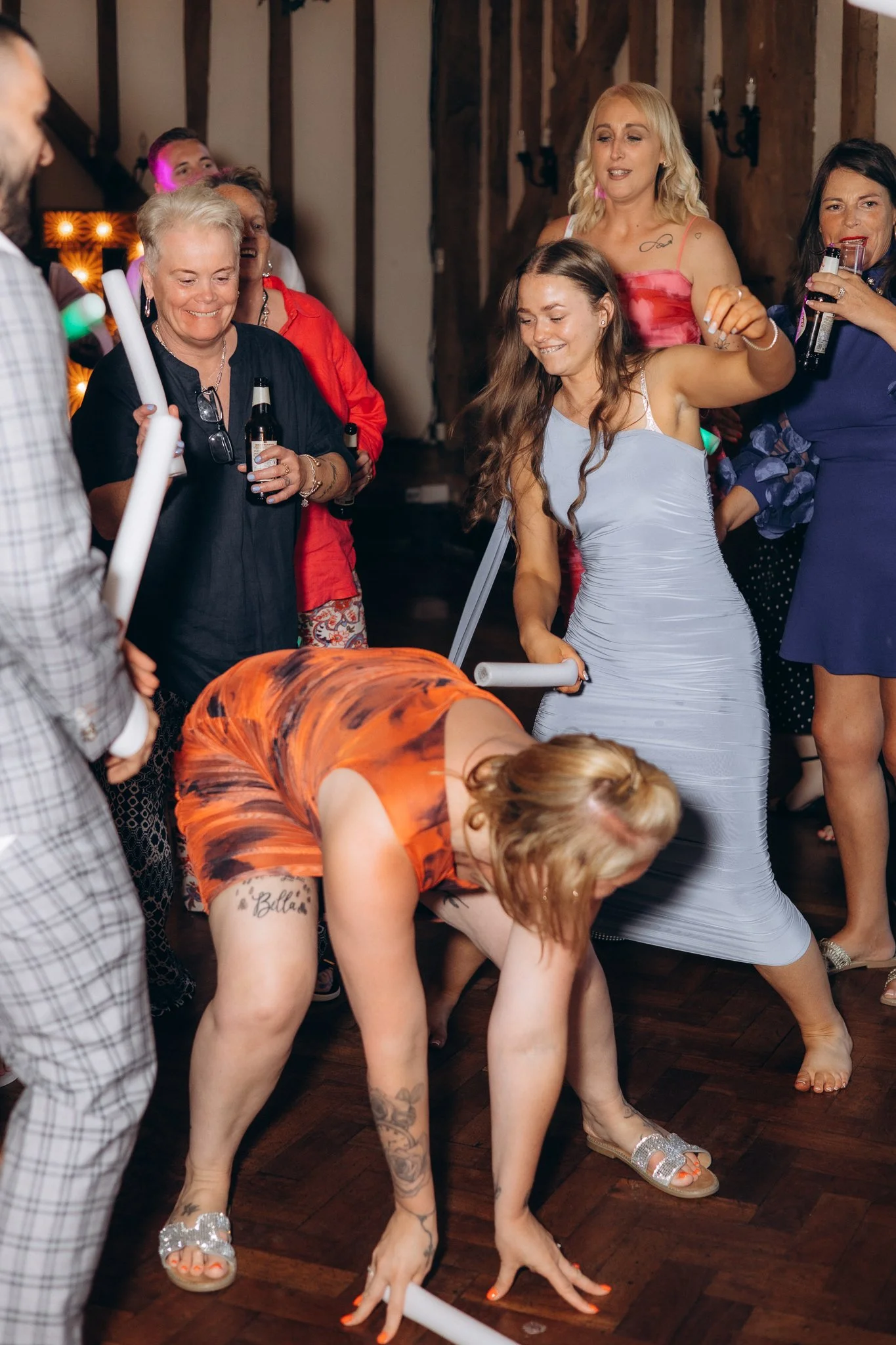 Guests dancing energetically at the outdoor evening reception