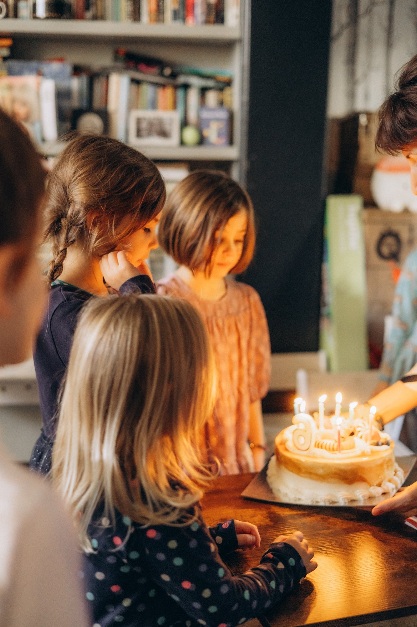 Birthday cake moment at a children's party, candid photography London
