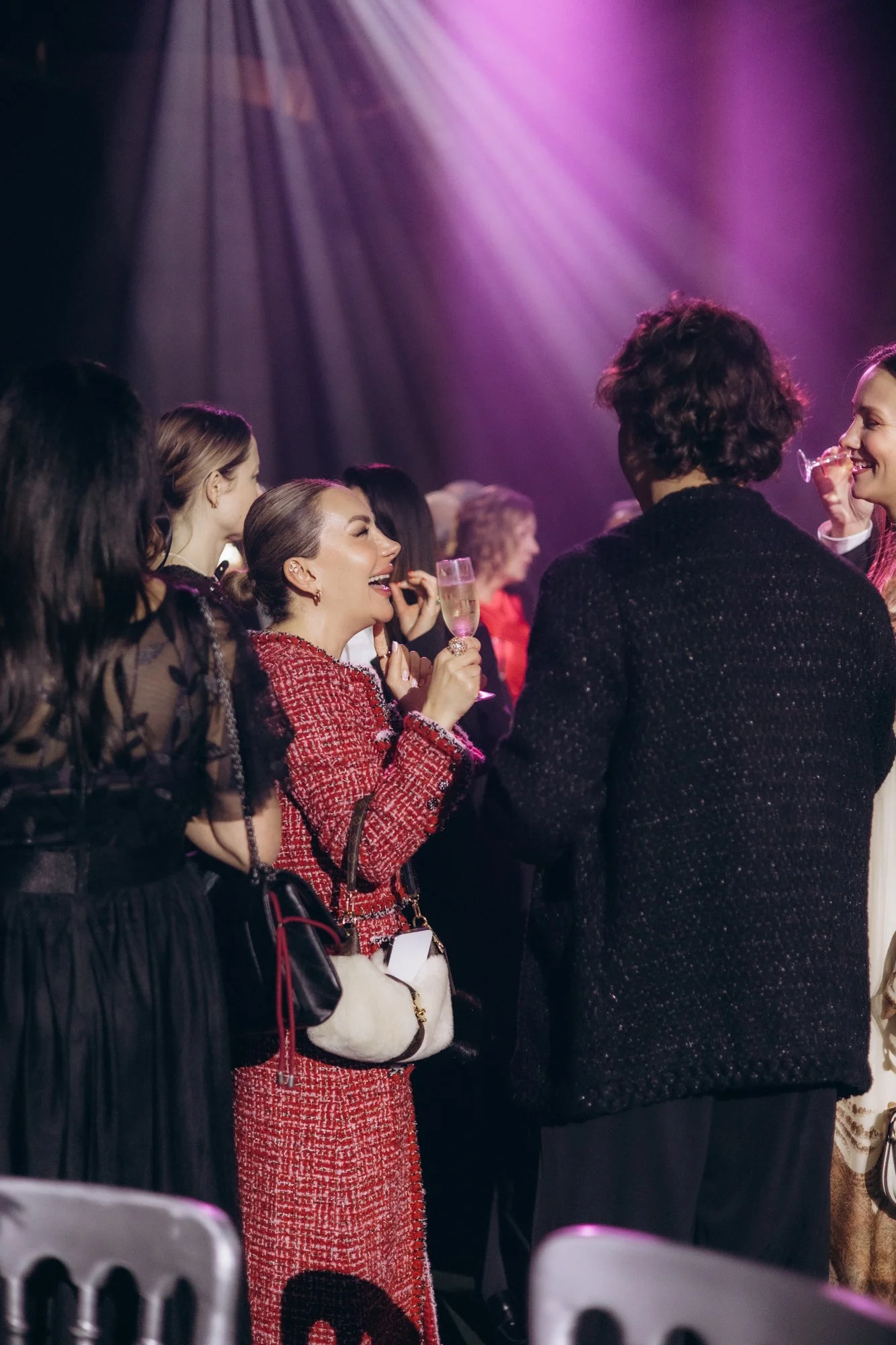 Guests chatting between courses at a black-tie gala in London
