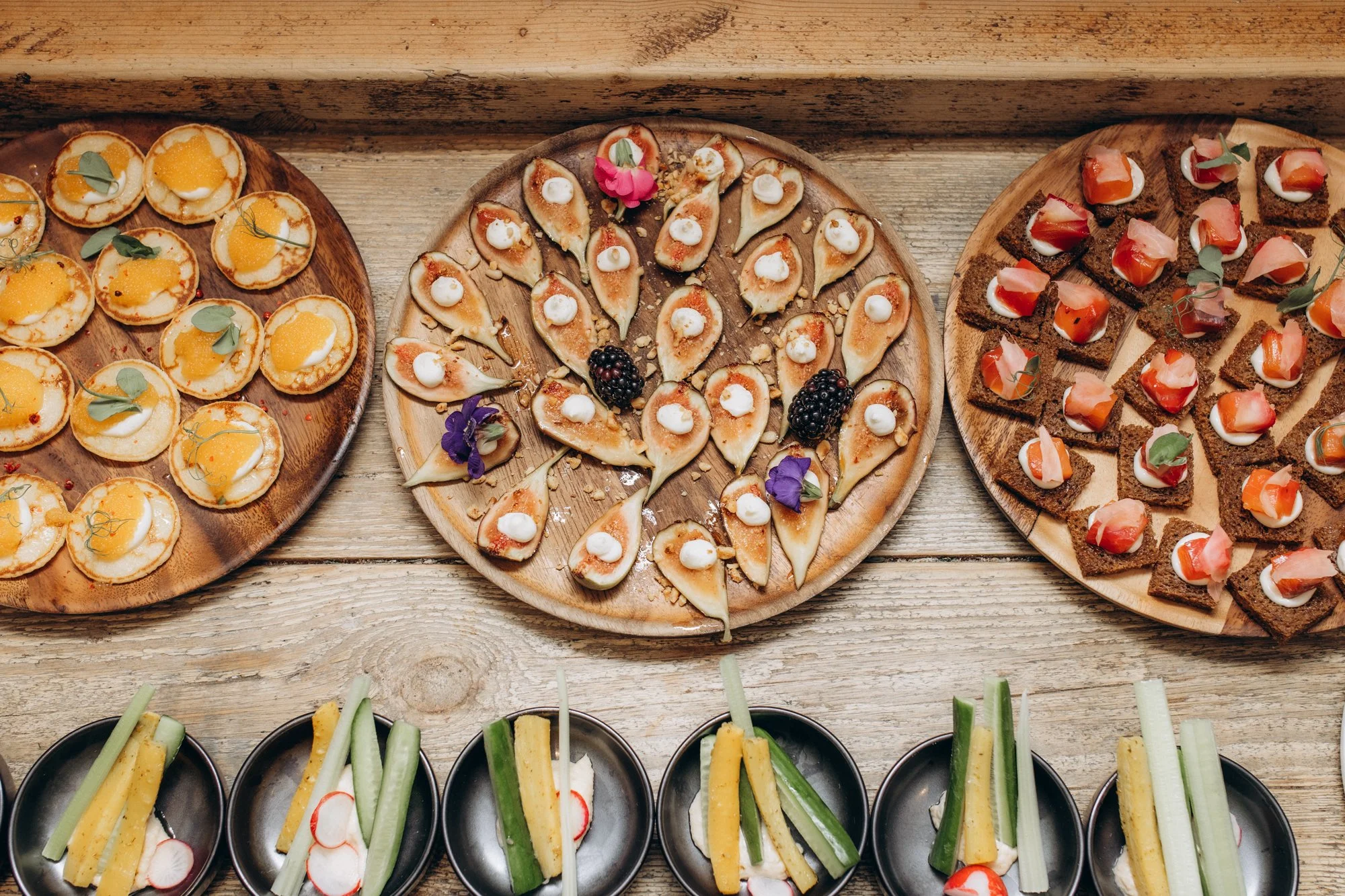 Canapés on wooden boards at a corporate drinks reception