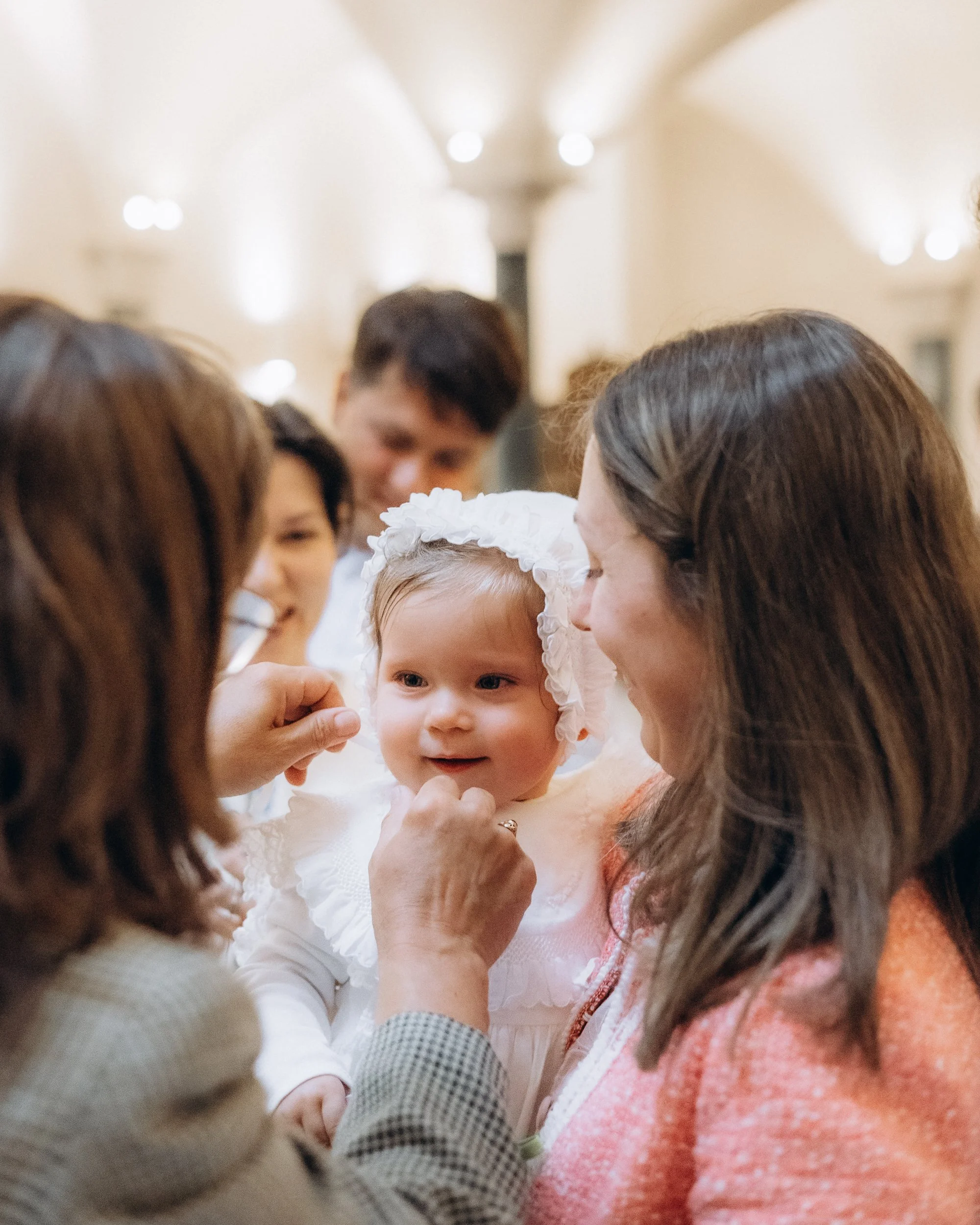 Godparents and family celebrating after christening, London photography