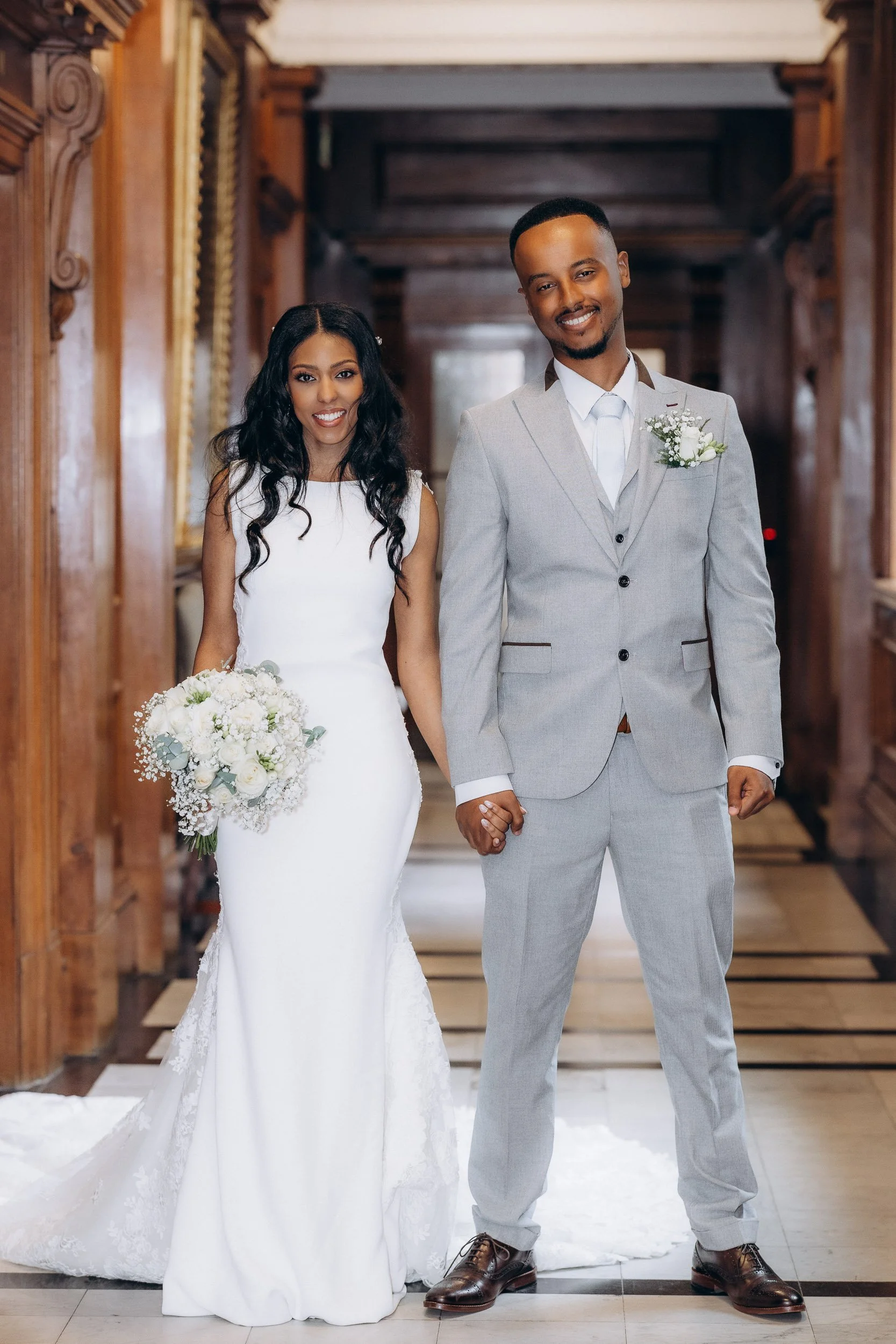 Wedding couple portrait in the wood-panelled corridor at Old Marylebone Town Hall