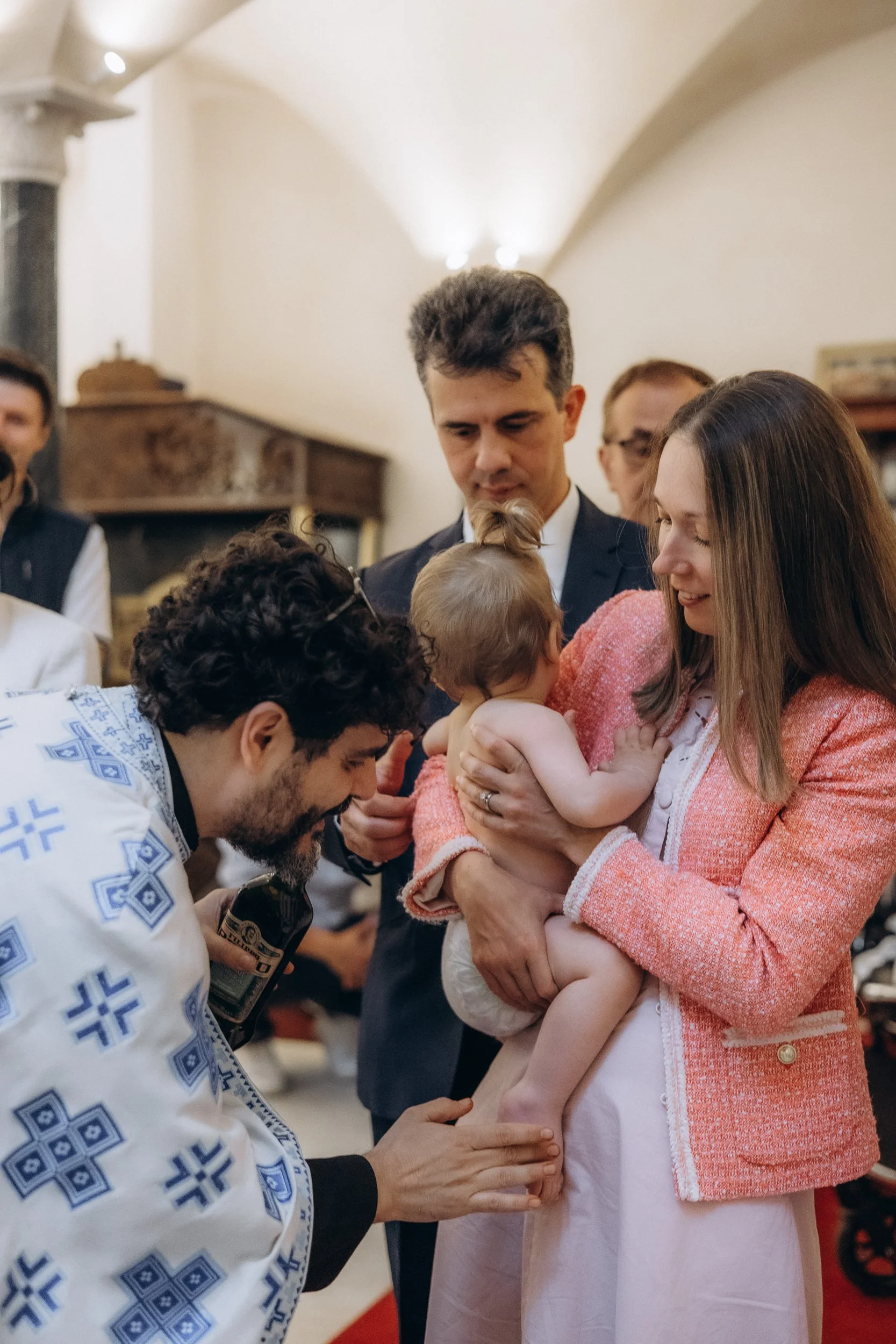 Family and godparents at a christening ceremony, London photographer