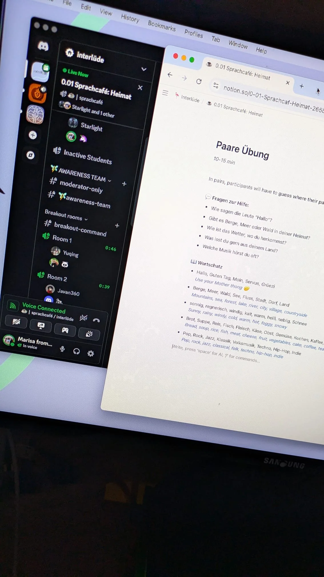 A computer displays an online workshop in German happens on the background while in the front is a document with exercises.