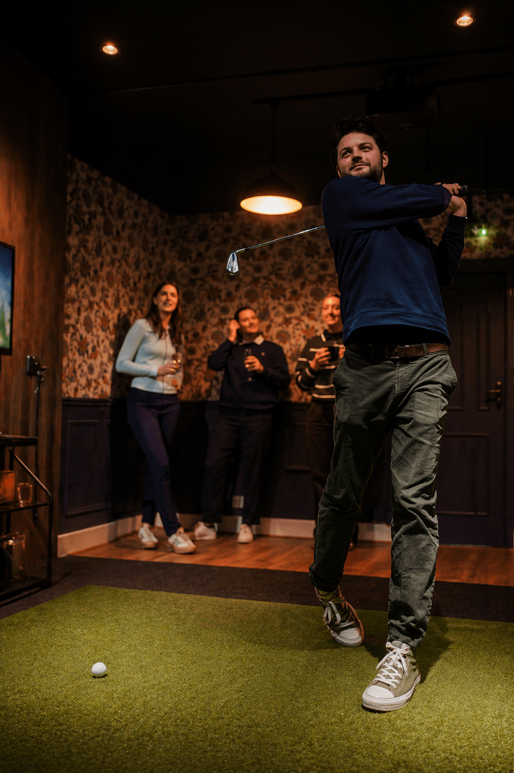 Private indoor virtual golf simulator bay at City Greens Golf in Norwich