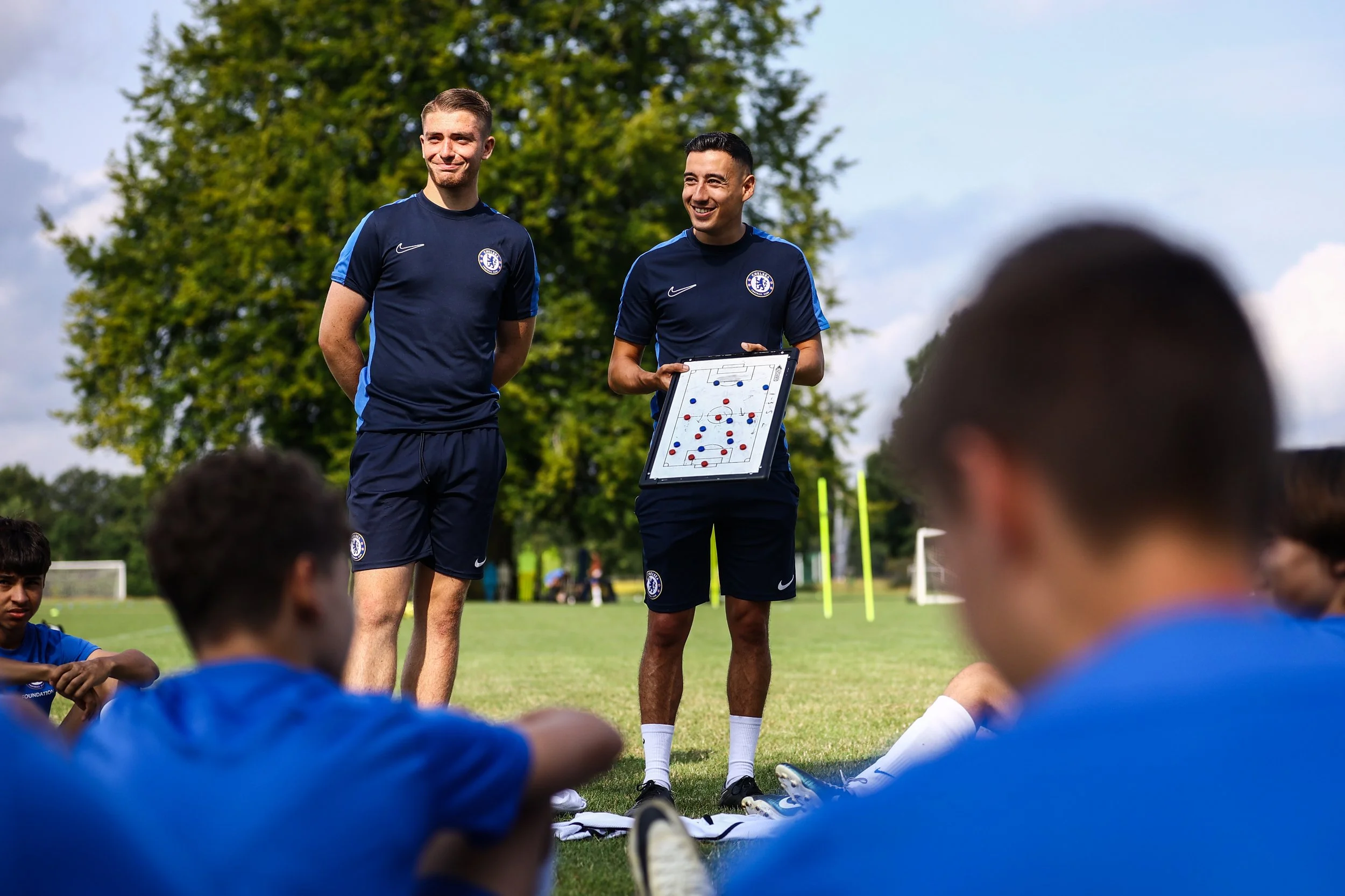 Chelsea FC coach talking to team on camp