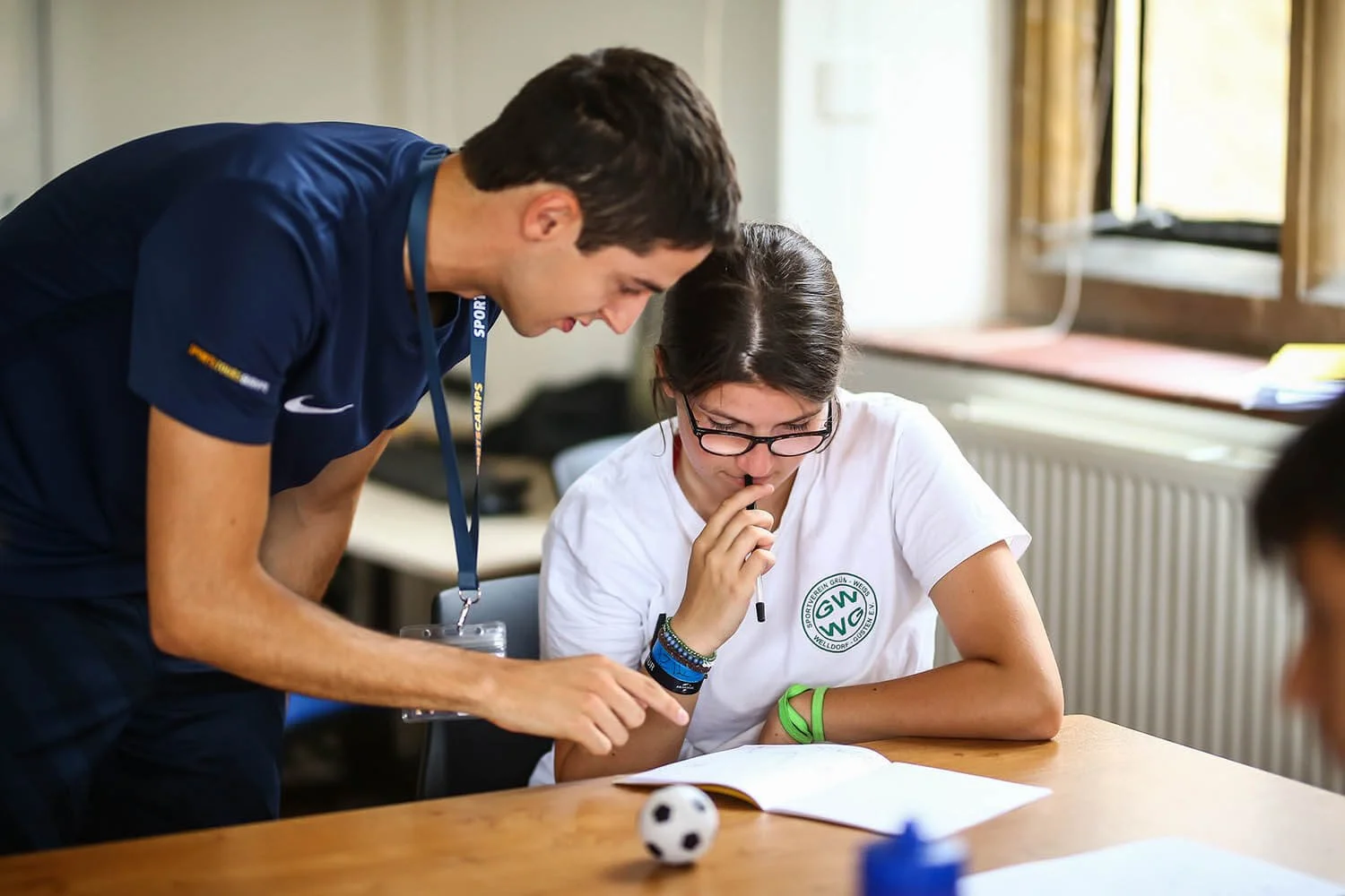 Teacher giving student feedback in class