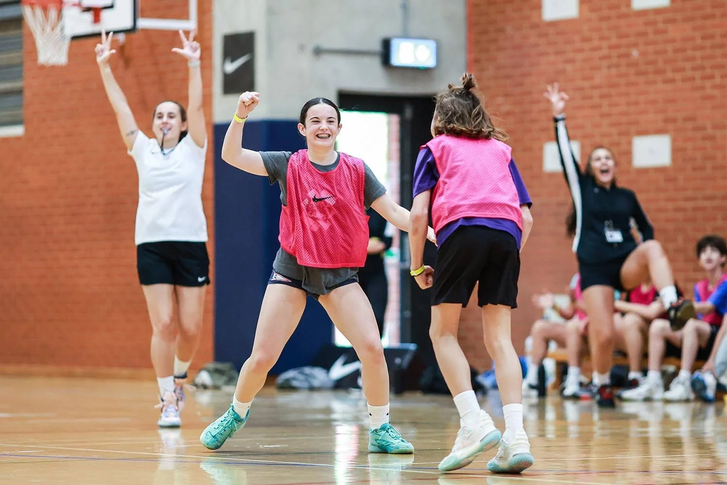Girls celebrating in basketball game