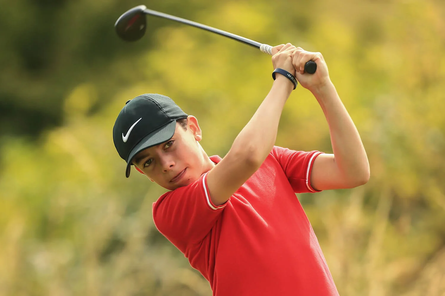 boy playing golf