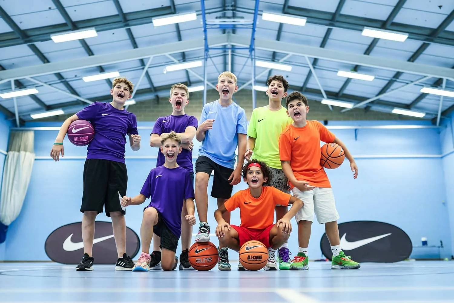 Basketball players on camp cheering