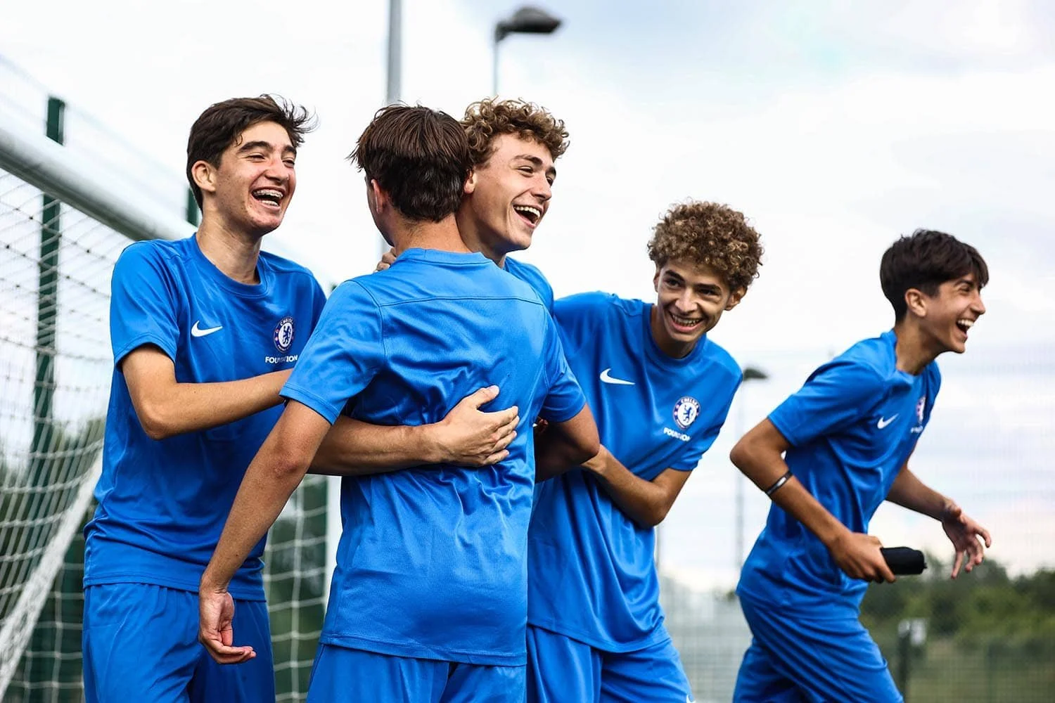 Football players celebrating goal
