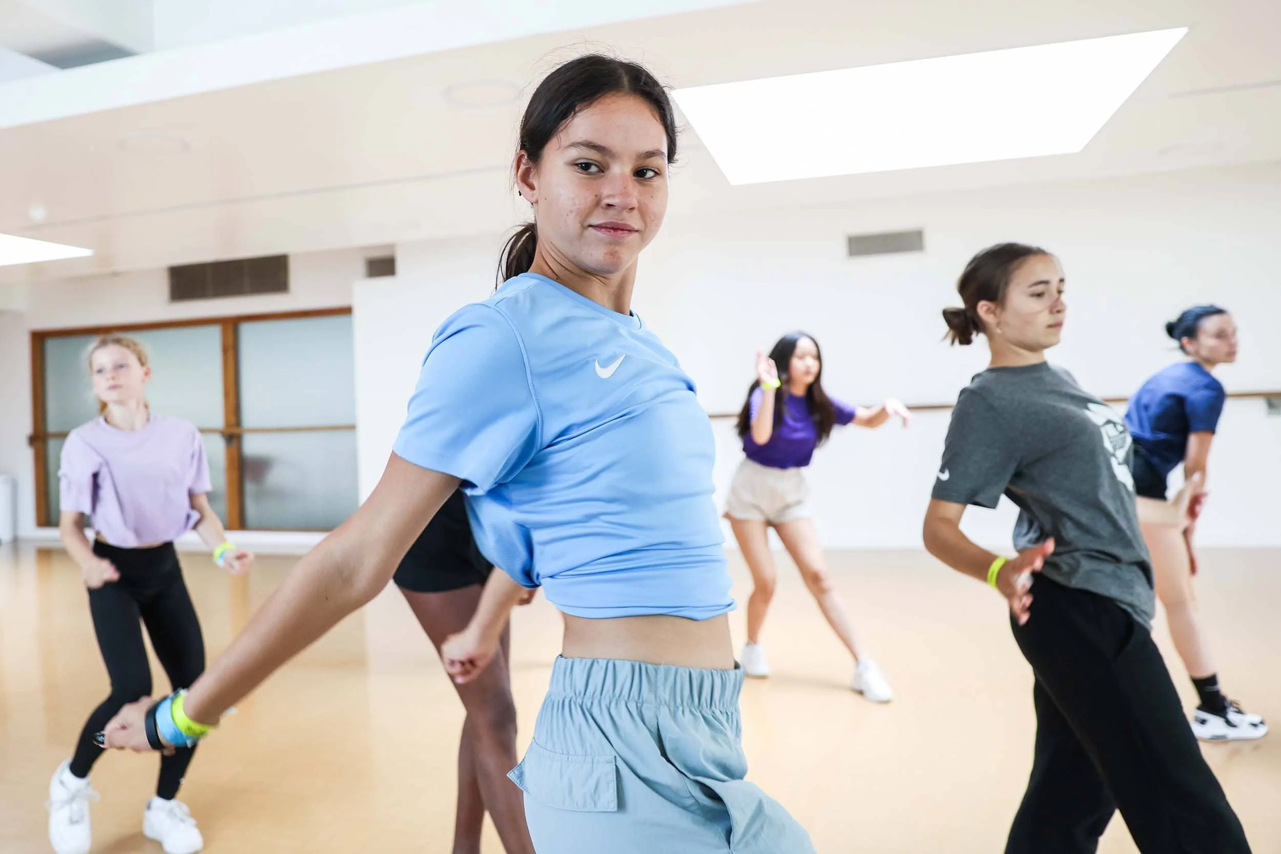 Group of dancers synchronising movement