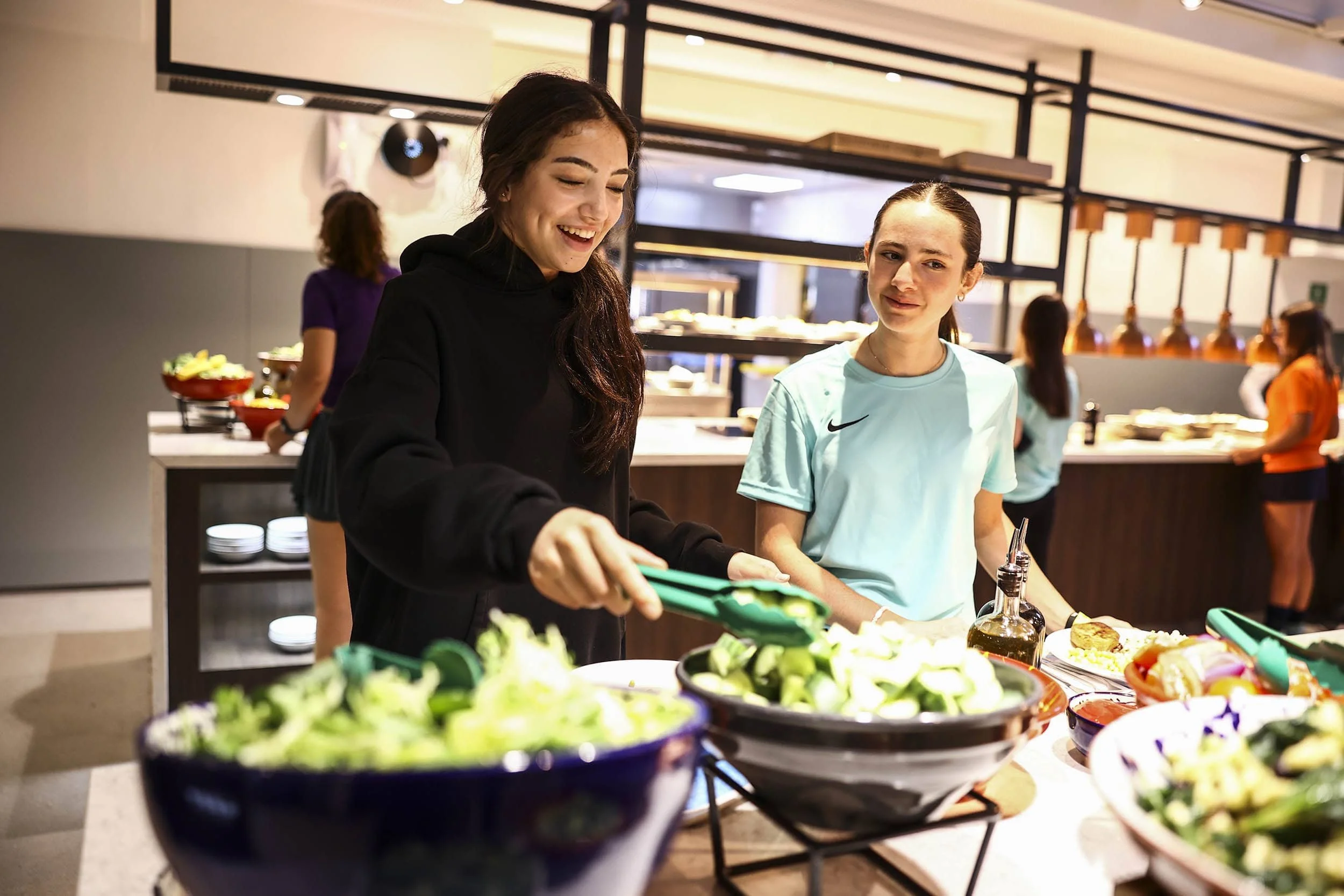 Dancers taking lunch in Bradfield College canteen