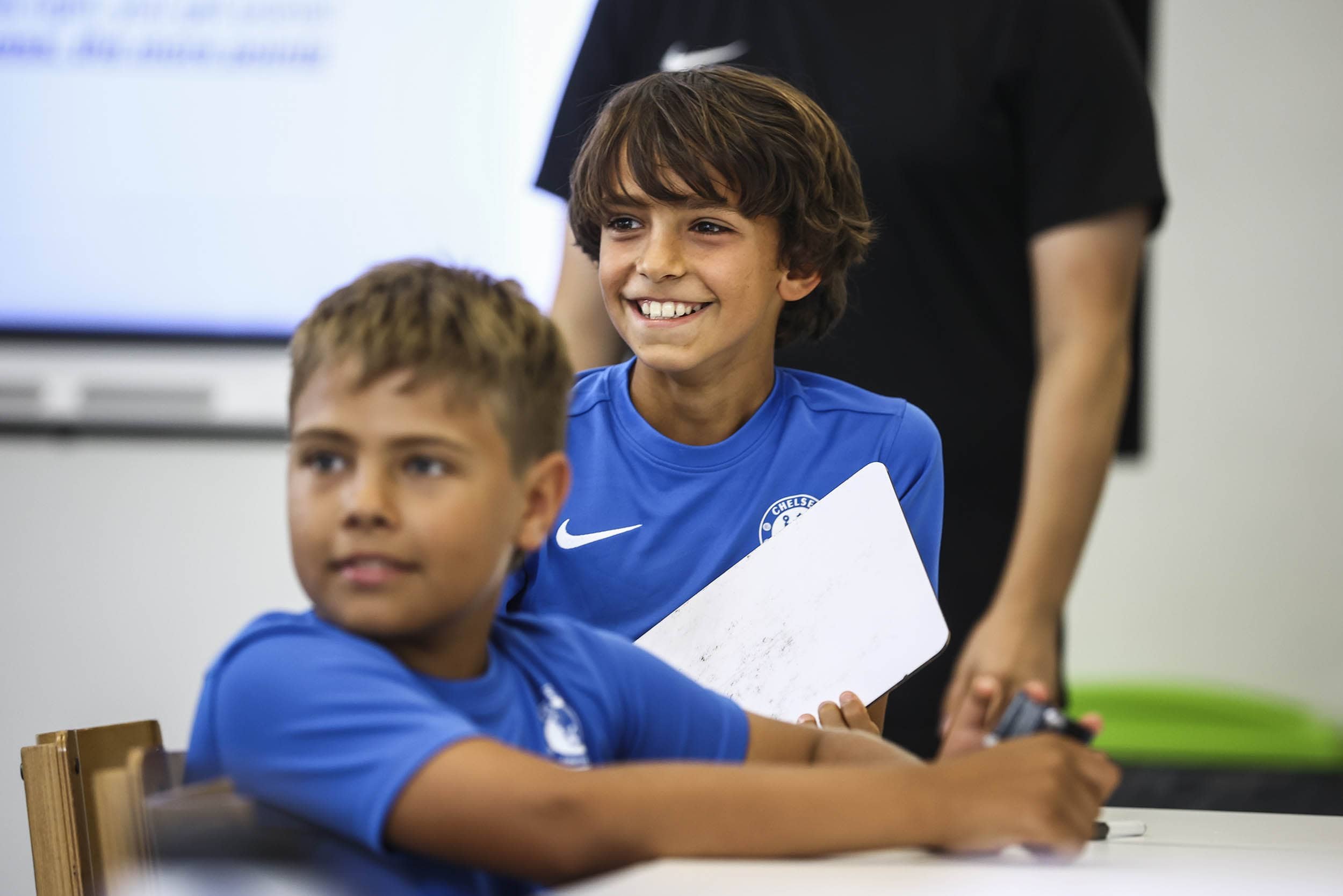 Boy smiling during EFL class on Chelsea FC camp