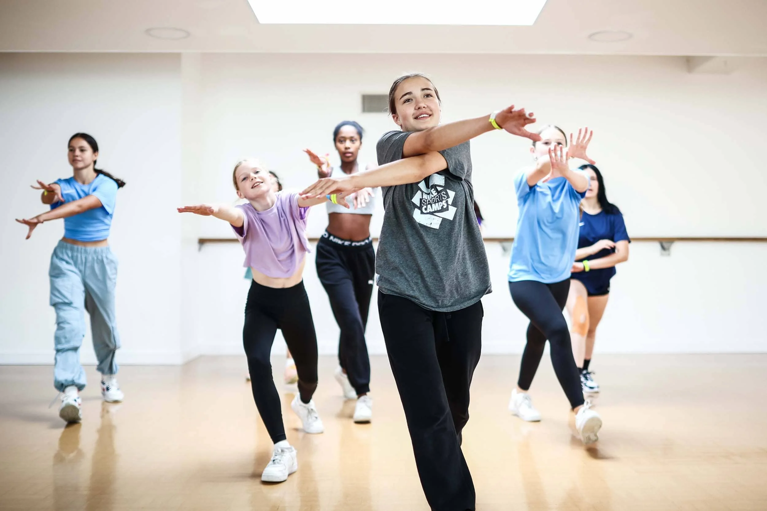 Dancers practising routine in the studio on camp