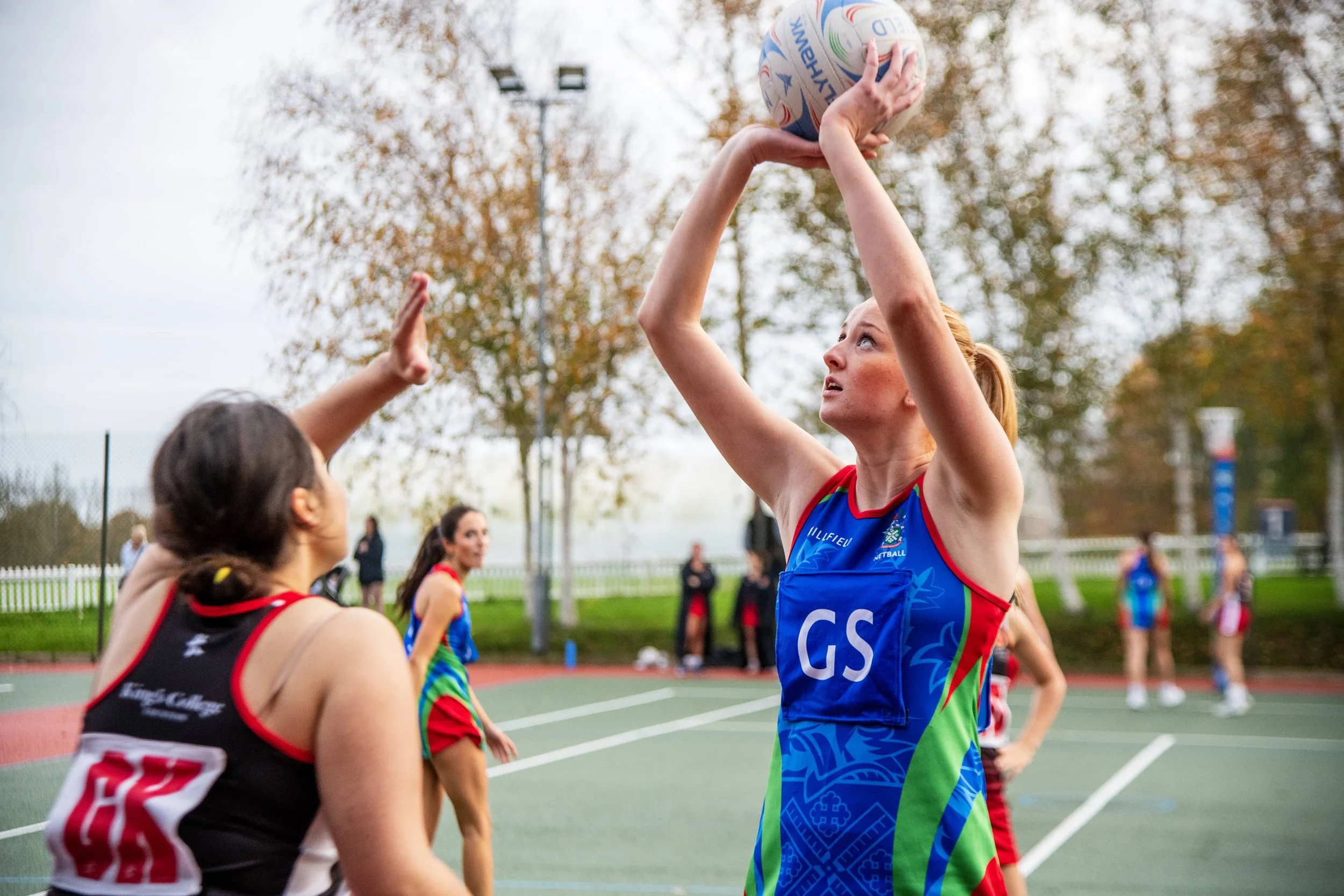 Netball player preparing to shoot