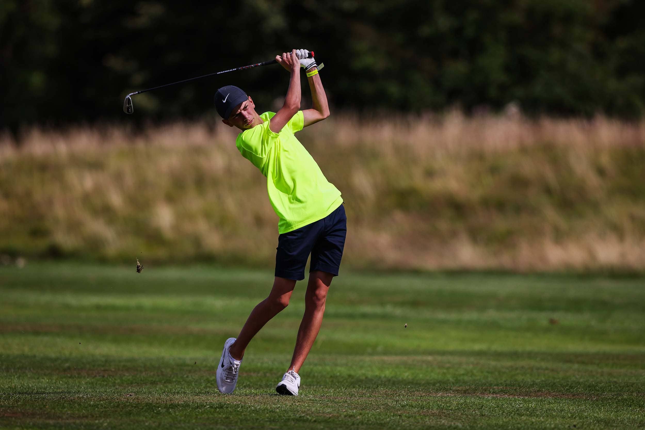 Golf player on Nike Camp practising swing