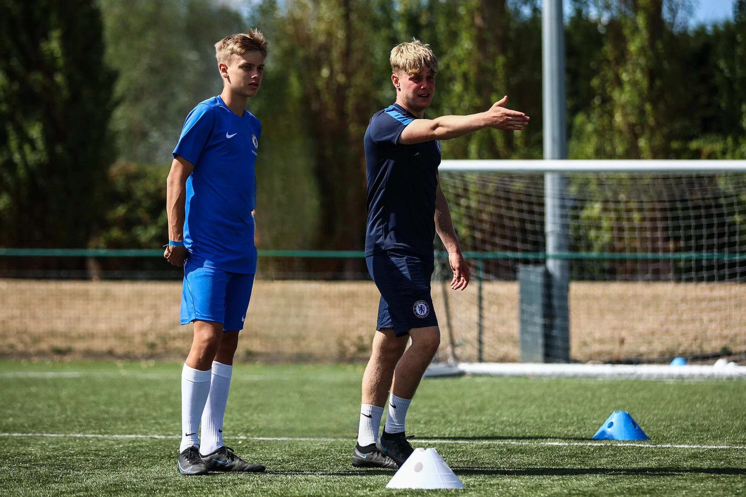 Chelsea FC coach talks to player in one to one session
