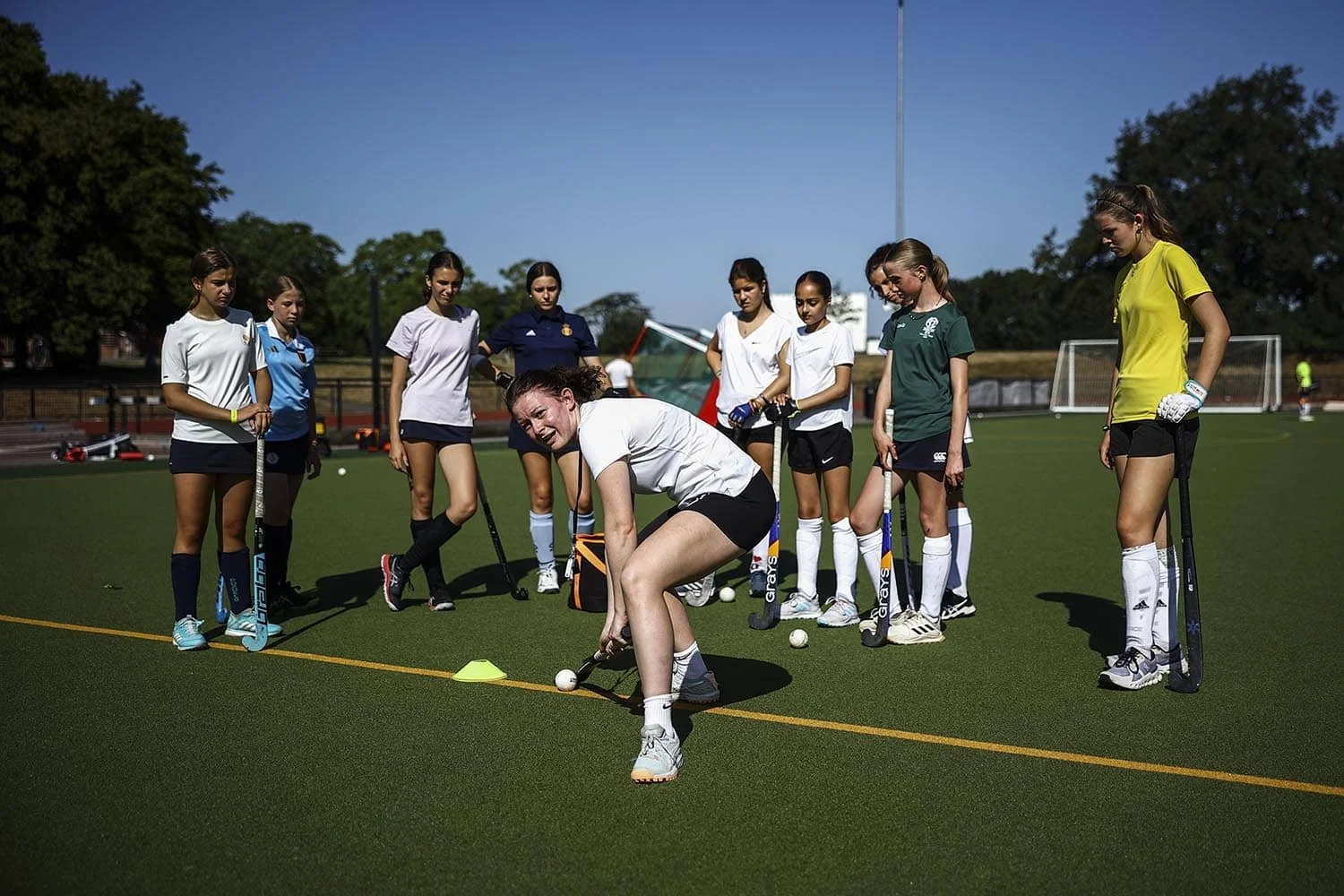 Hockey player and coach during morning training