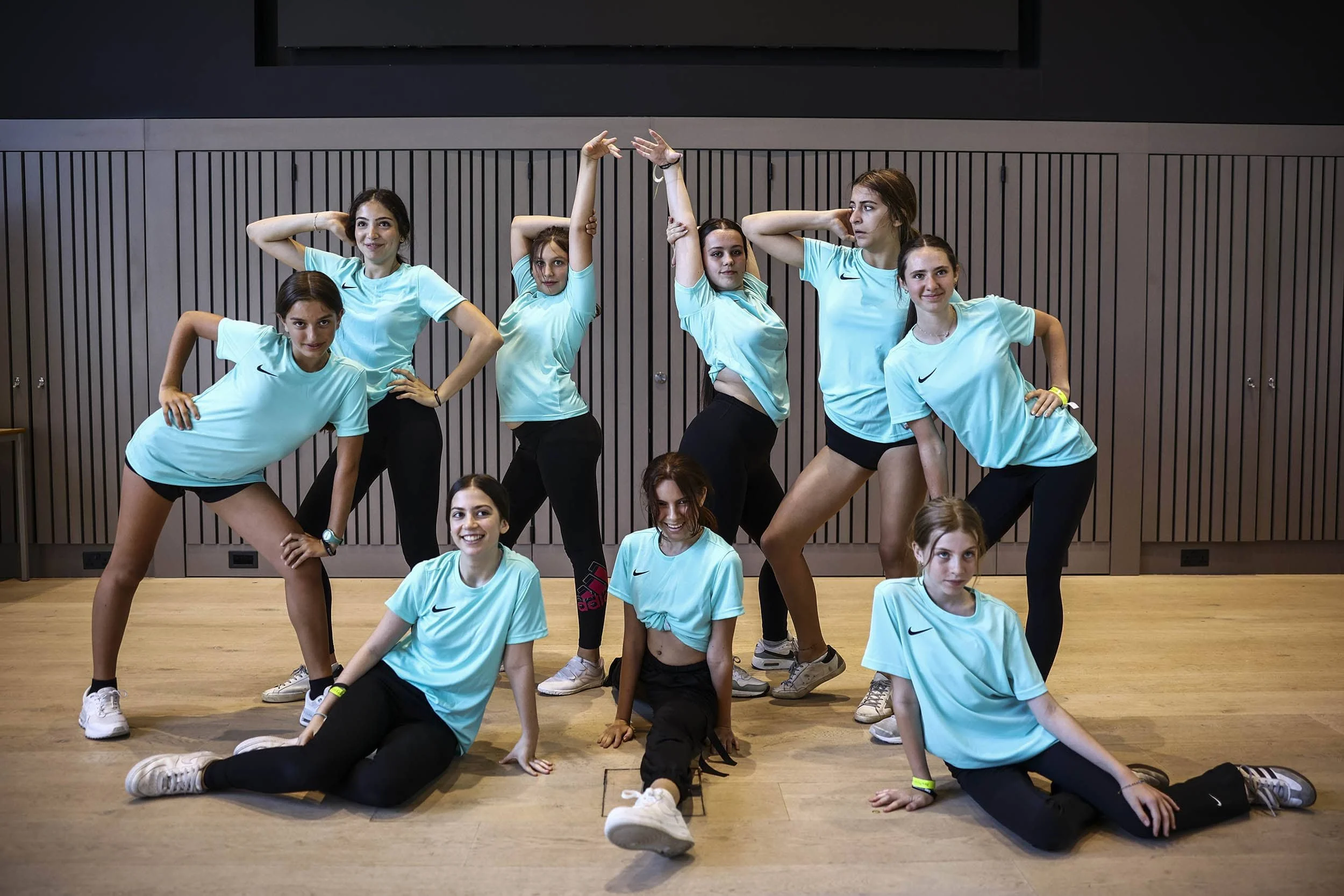 Group of dancers posing after final performance on Nike Dance Camp