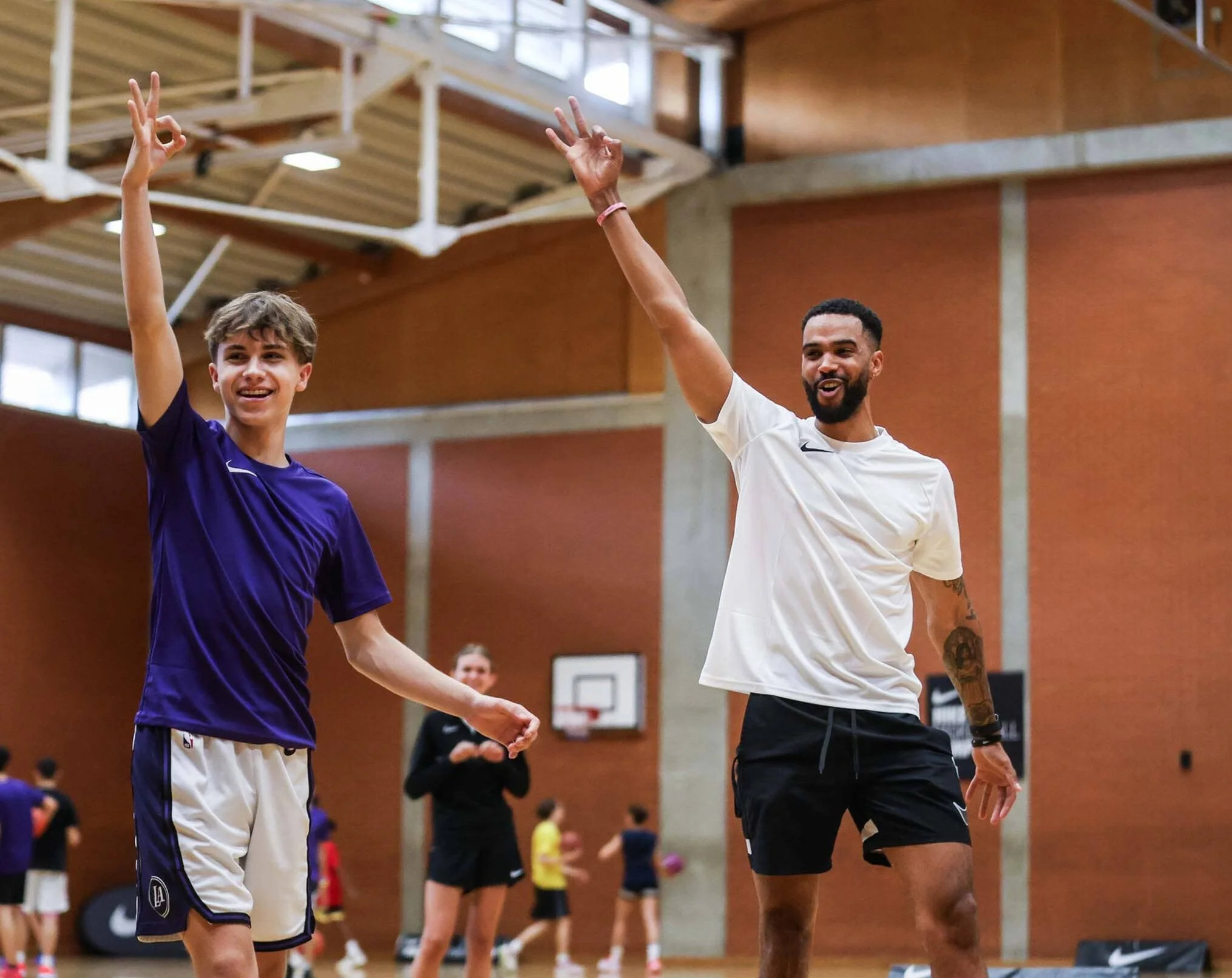 Basketball coach and player joining for celebration