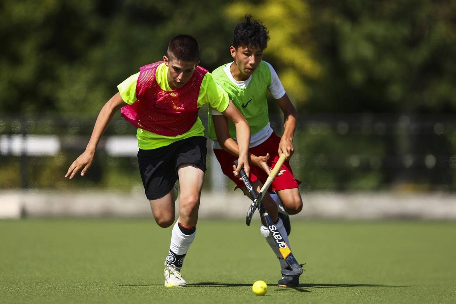 boys battling on the hockey pitch