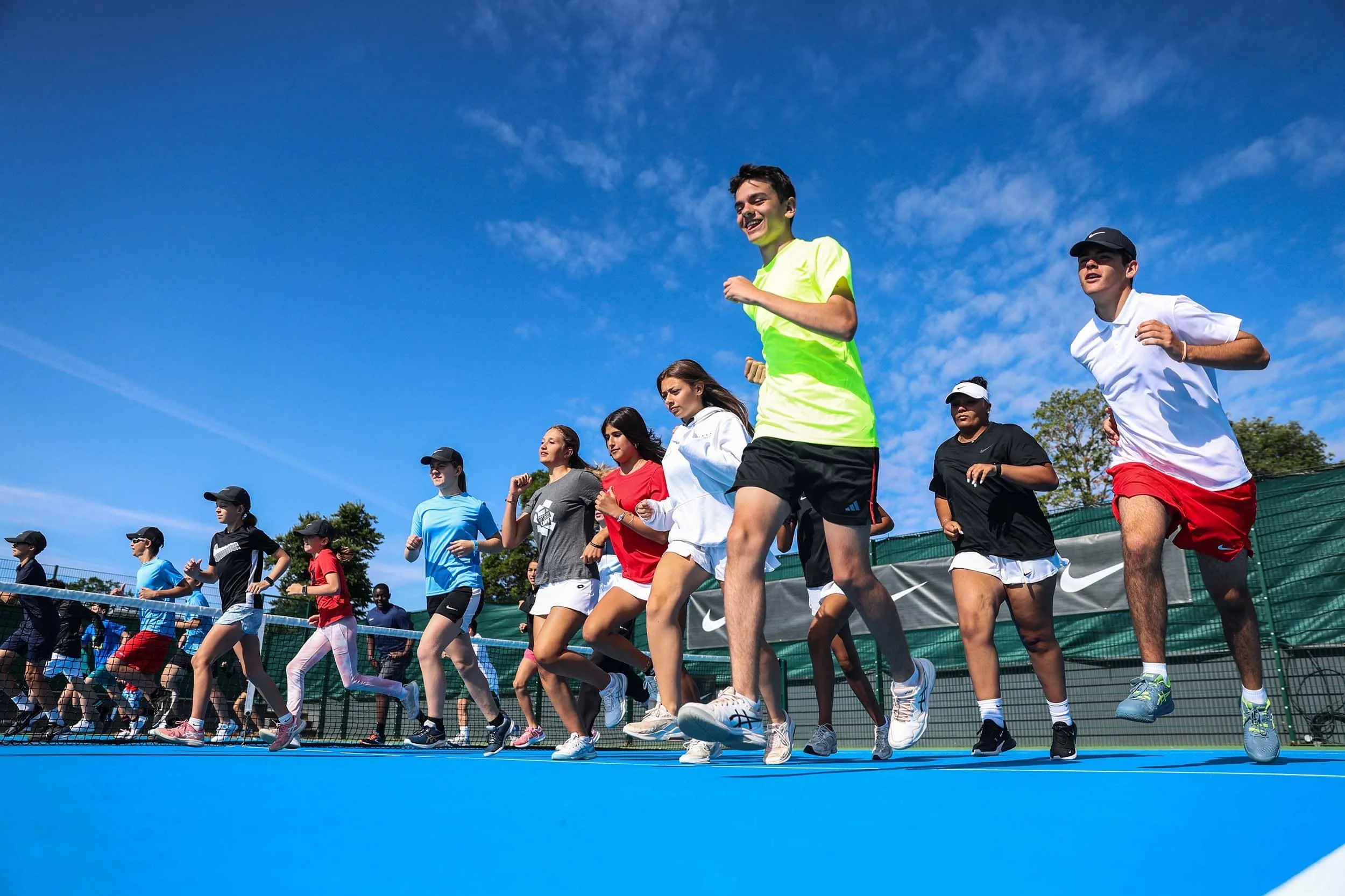 Tennis players warming up on camp