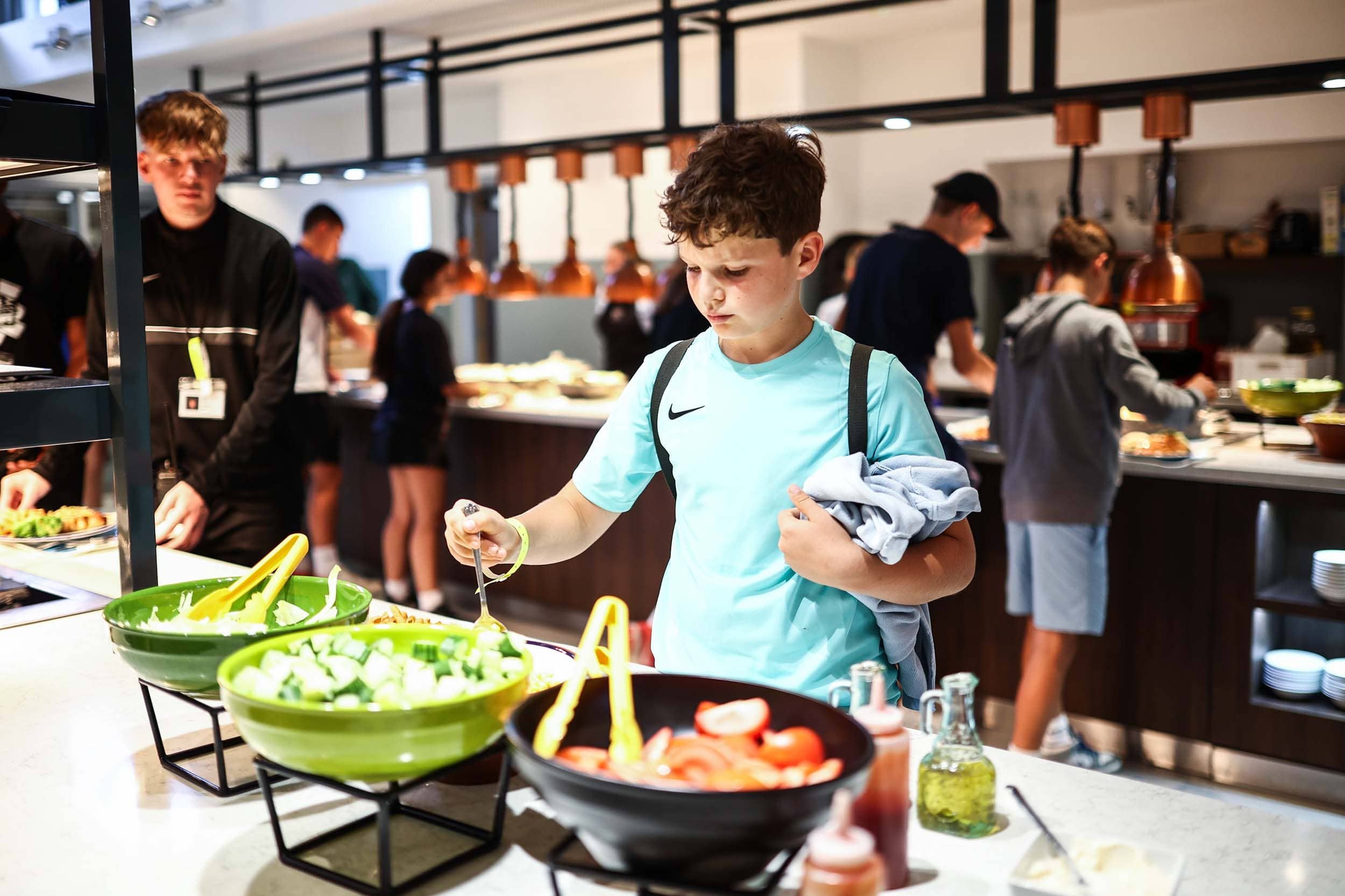Boy at Bradfield College Nike Sports Camp taking lunch