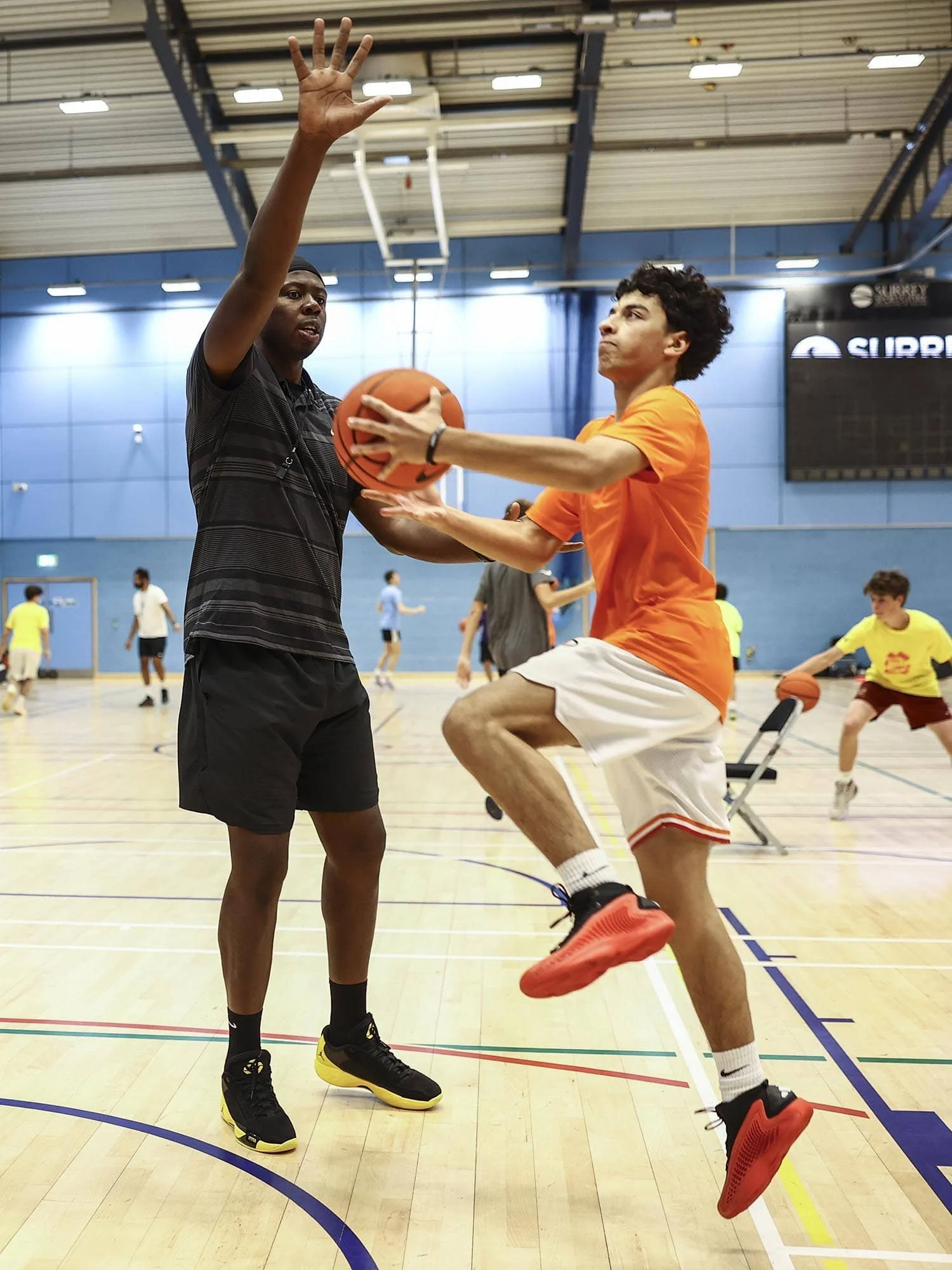 Eric Boateng blocking attack from Nike Basketball player