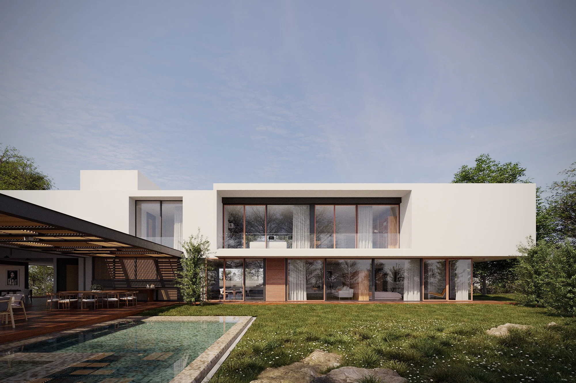 Modern two-story house with large glass windows, surrounded by greenery, with a swimming pool in the foreground and an outdoor dining area on the left.