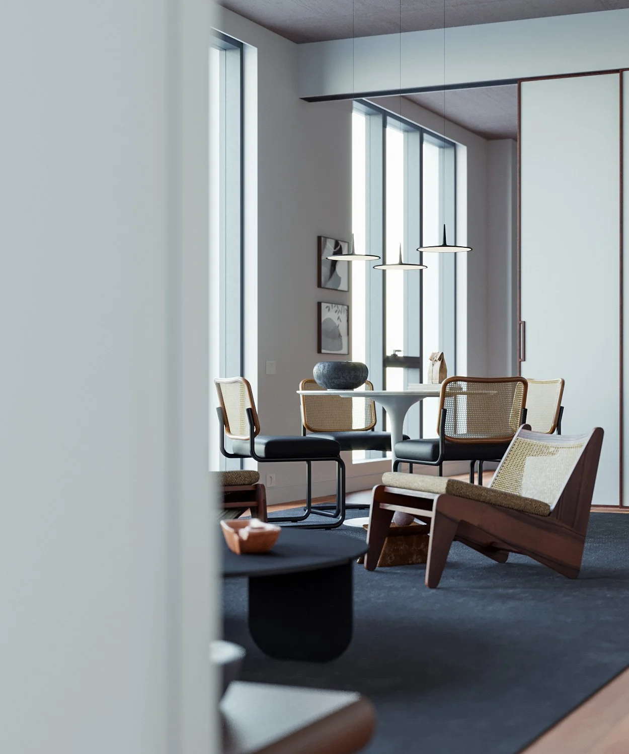 Modern interior dining area with a round table, seven chairs with woven backs, and large windows, featuring minimalist decor and pendant lighting.