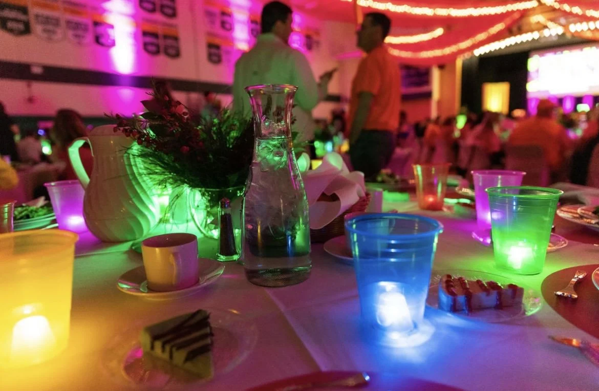 glowing cups and table decoration at auction event