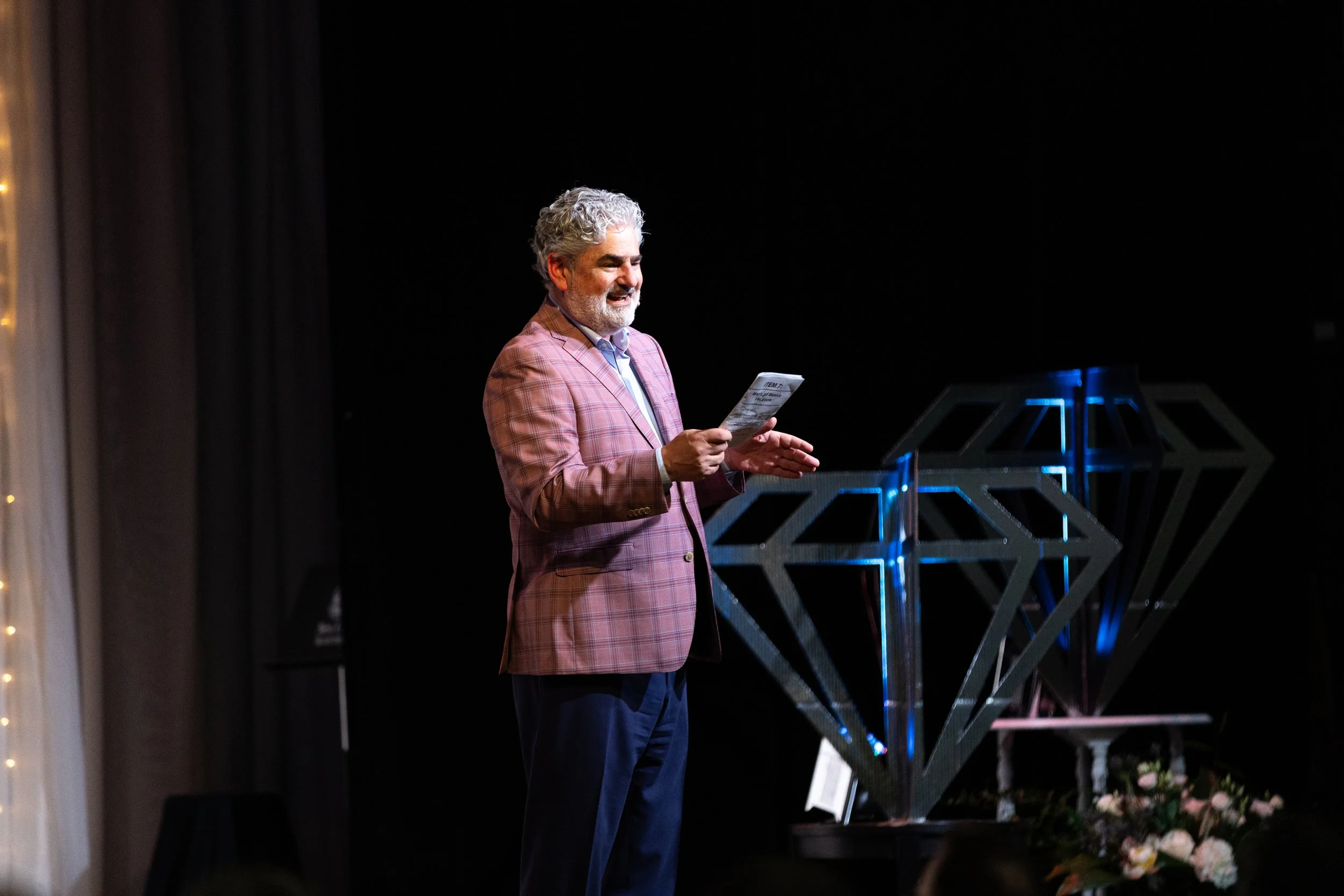 PA on stage with diamonds in background.jpg