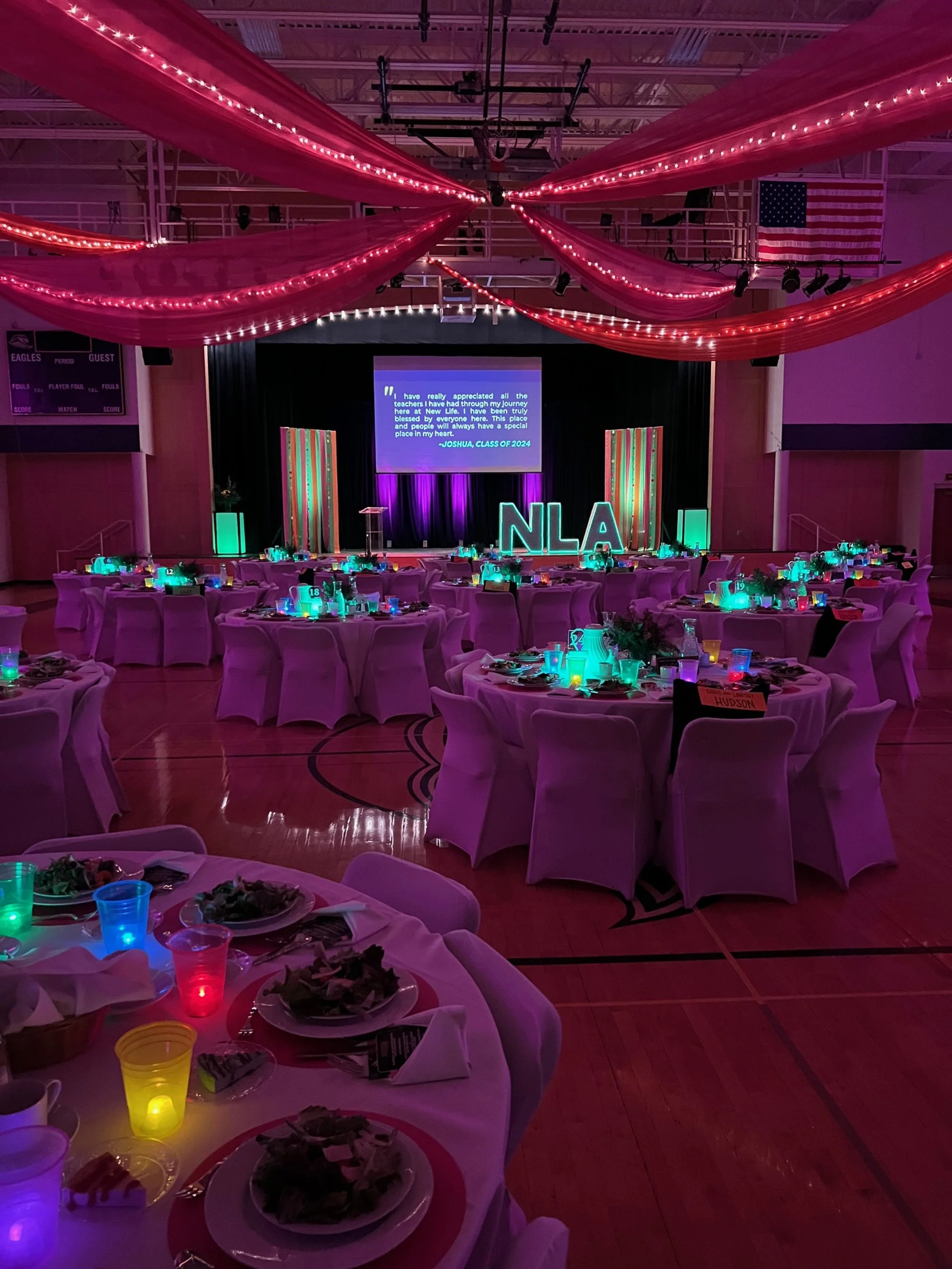 room and stage glowing for auction event