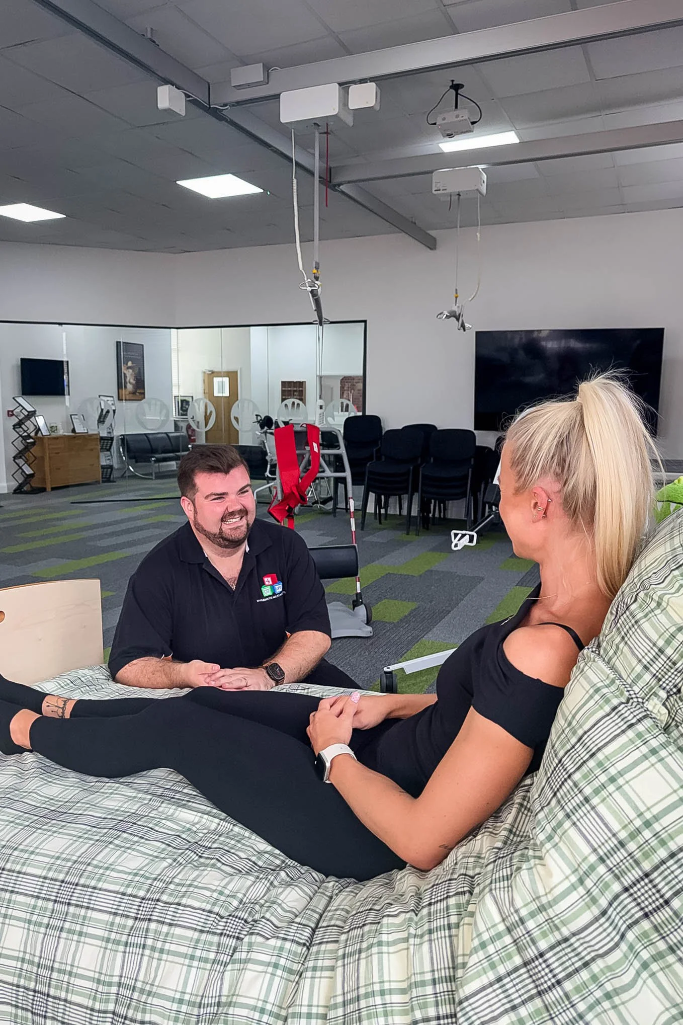 Occupational therapist talking with a client during a therapy session at OT 4 Life