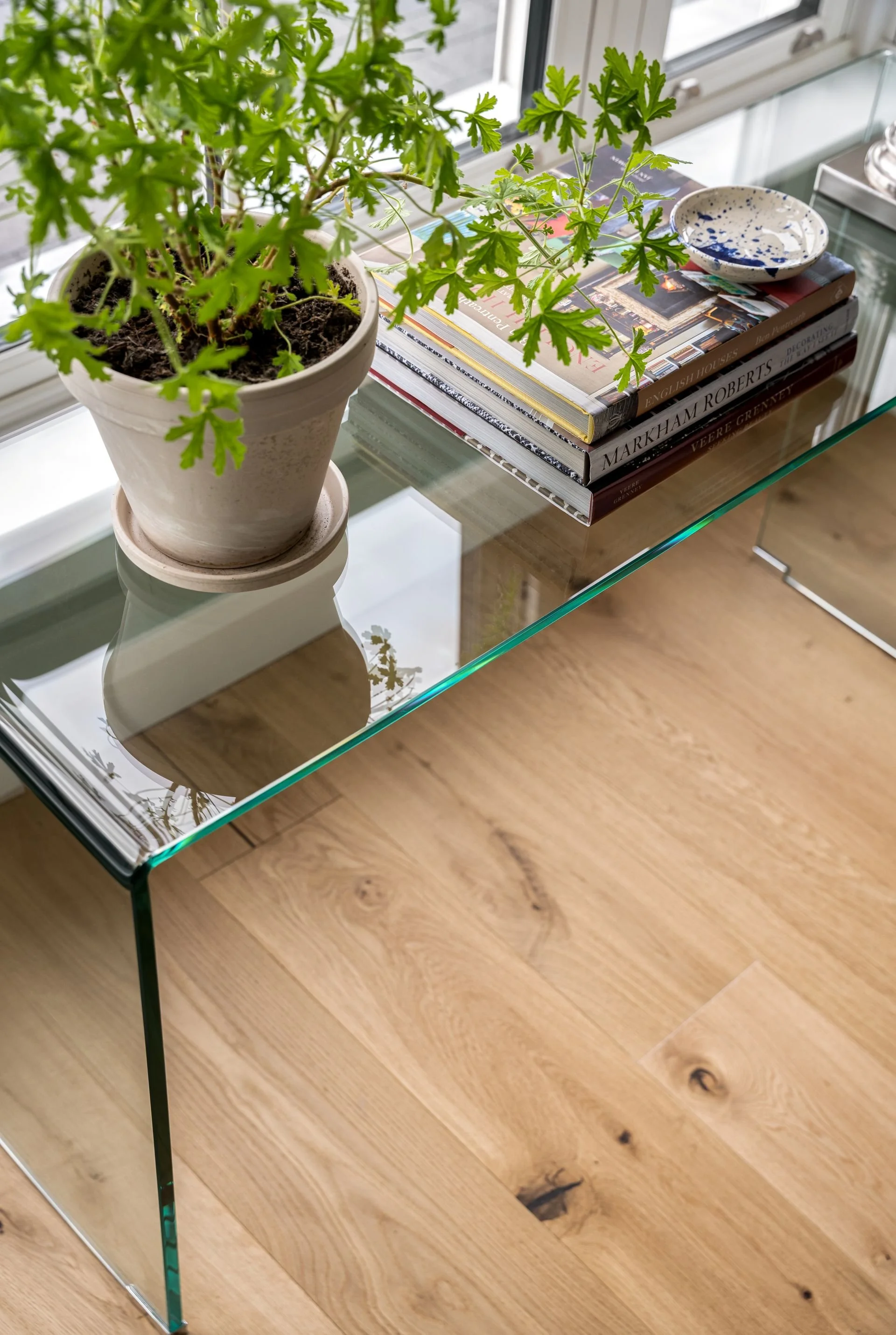 Glass console table in Kilkenny new build sitting room with oak plank floors.