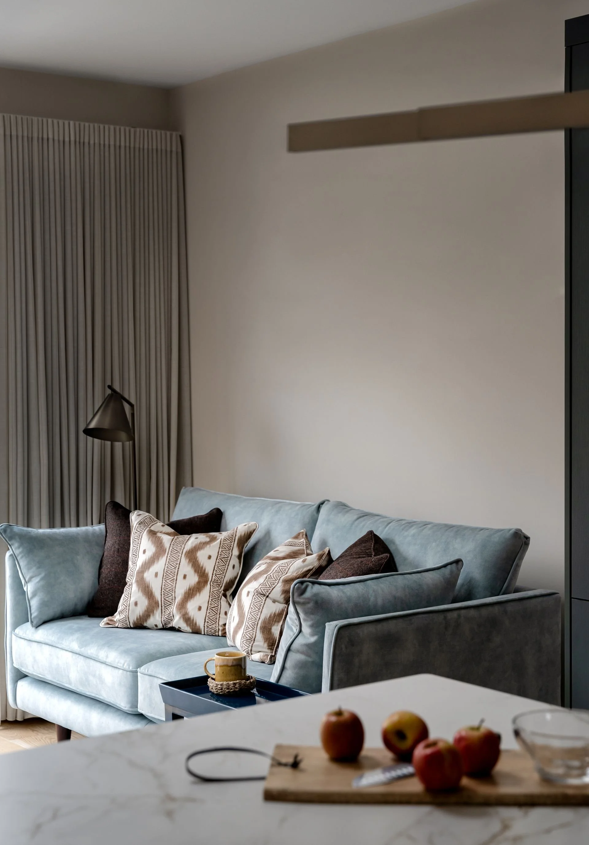 Kilkenny kitchen living diner space with custom blue sofa and curtains.