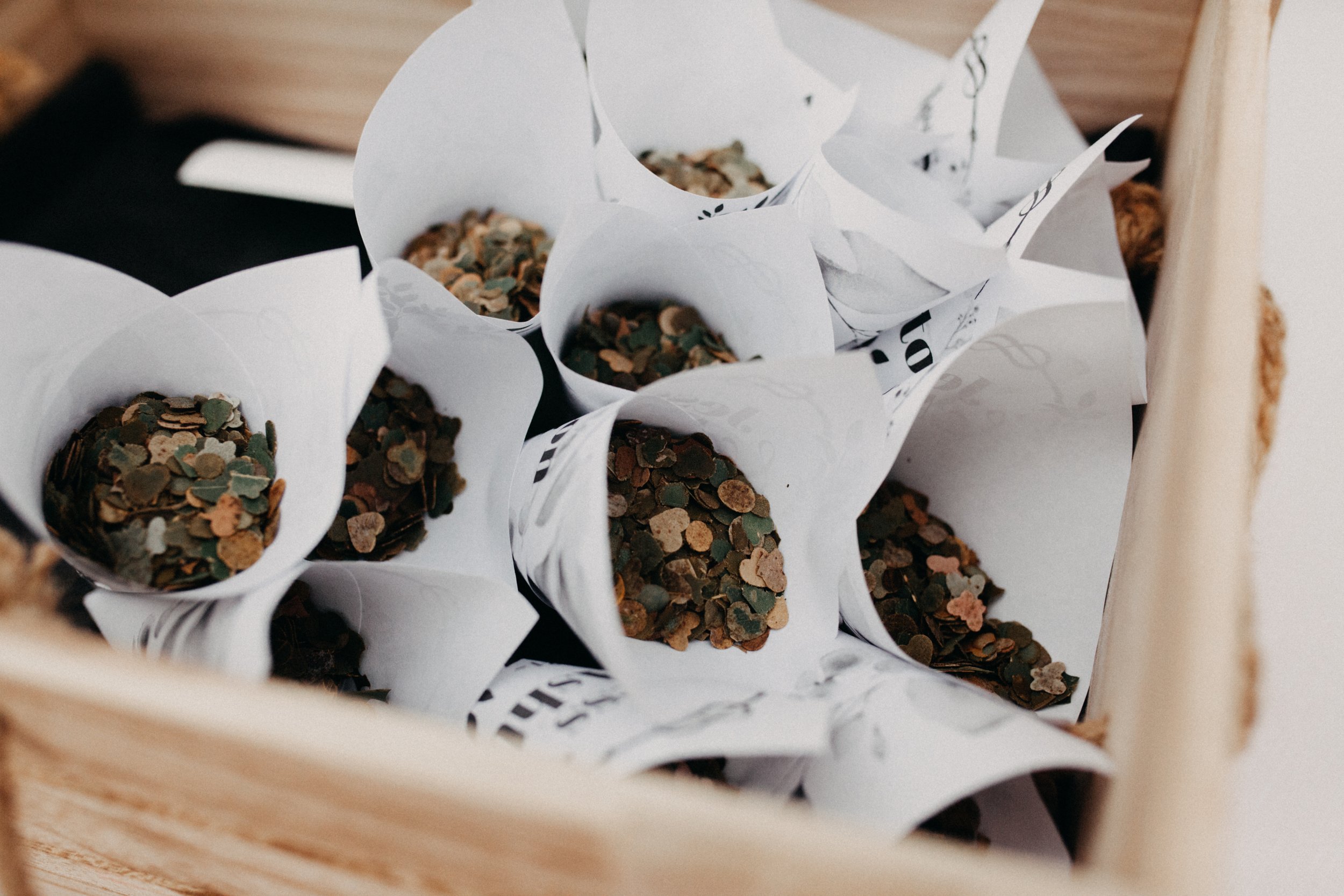 Rustic paper cones filled with dried herbs used as natural confetti — a charming touch for boutique Blue Mountains elopements.